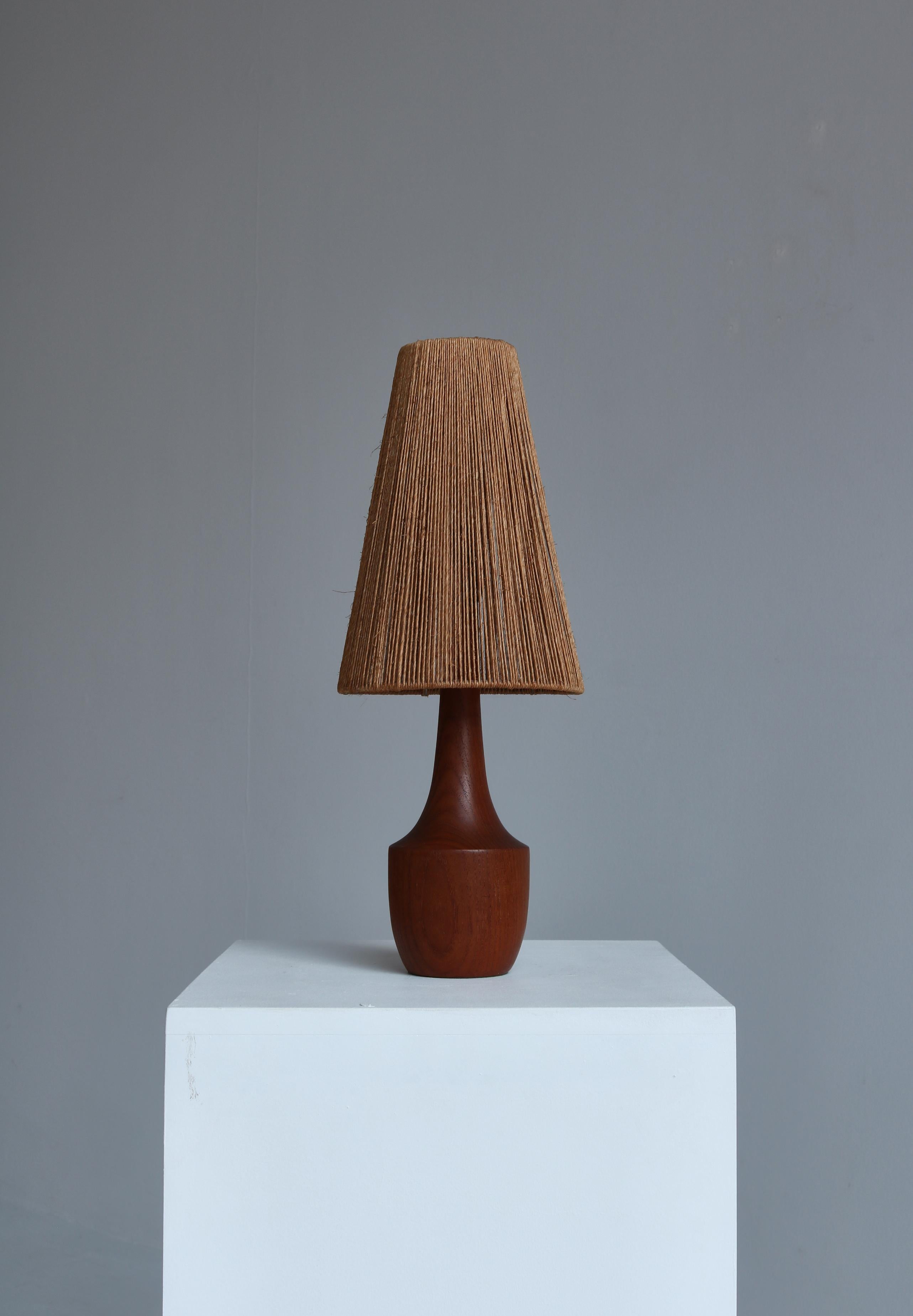 Wonderful table lamp made in Denmark in the 1950s. The base is made of solid turned Bangkok teakwood and the shade consists of sisal strings. The lamp is attributed to the Danish designer Ib Fabiansen who made a lot of similar lamps in this period.