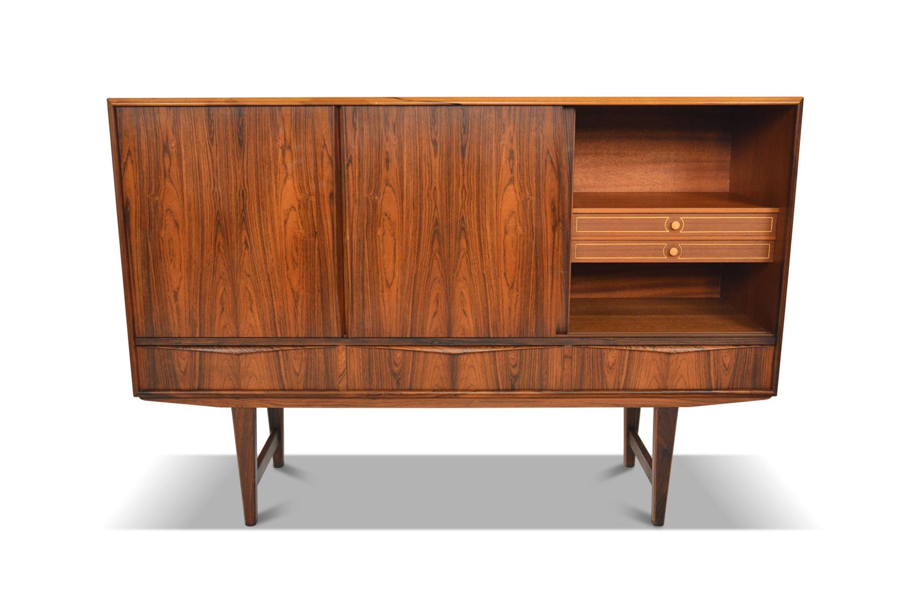 Origin: Denmark
Designer: E.W. Bach
Manufacturer: Sejling Skabe
Era: 1960s
Materials: Rosewood
Dimensions: 65 wide x 17.5 deep x 44.5 tall, Interior Sections: 20 wide x 15.5 deep x 22 tall

Condition: In excellent original condition.