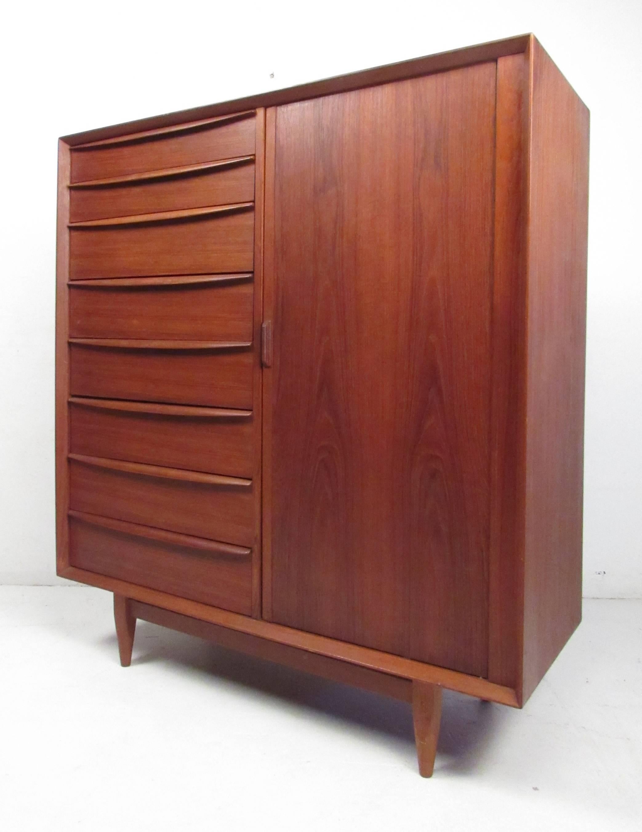 Quality teak Danish modern matching dresser and chest of drawers by Arne Wahl Iverson for Falster. Beautifully designed with multiple storage options, curved drawer pulls, dovetail construction, and tapered legs - this pair would make both a