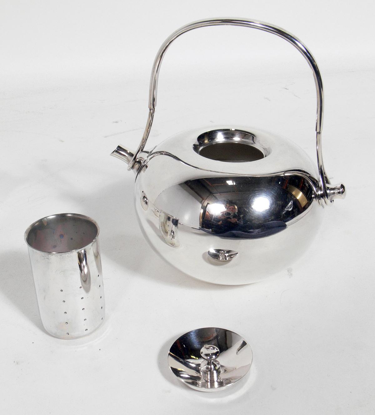 Danish modern tea service, designed by Vivianna Torun Bülow-Hübe for Dansk International Designs, Ltd, Sweden, circa 1960s. It is constructed of silver plated brass. It has recently been hand polished. The service includes one tray, tea pot, sugar