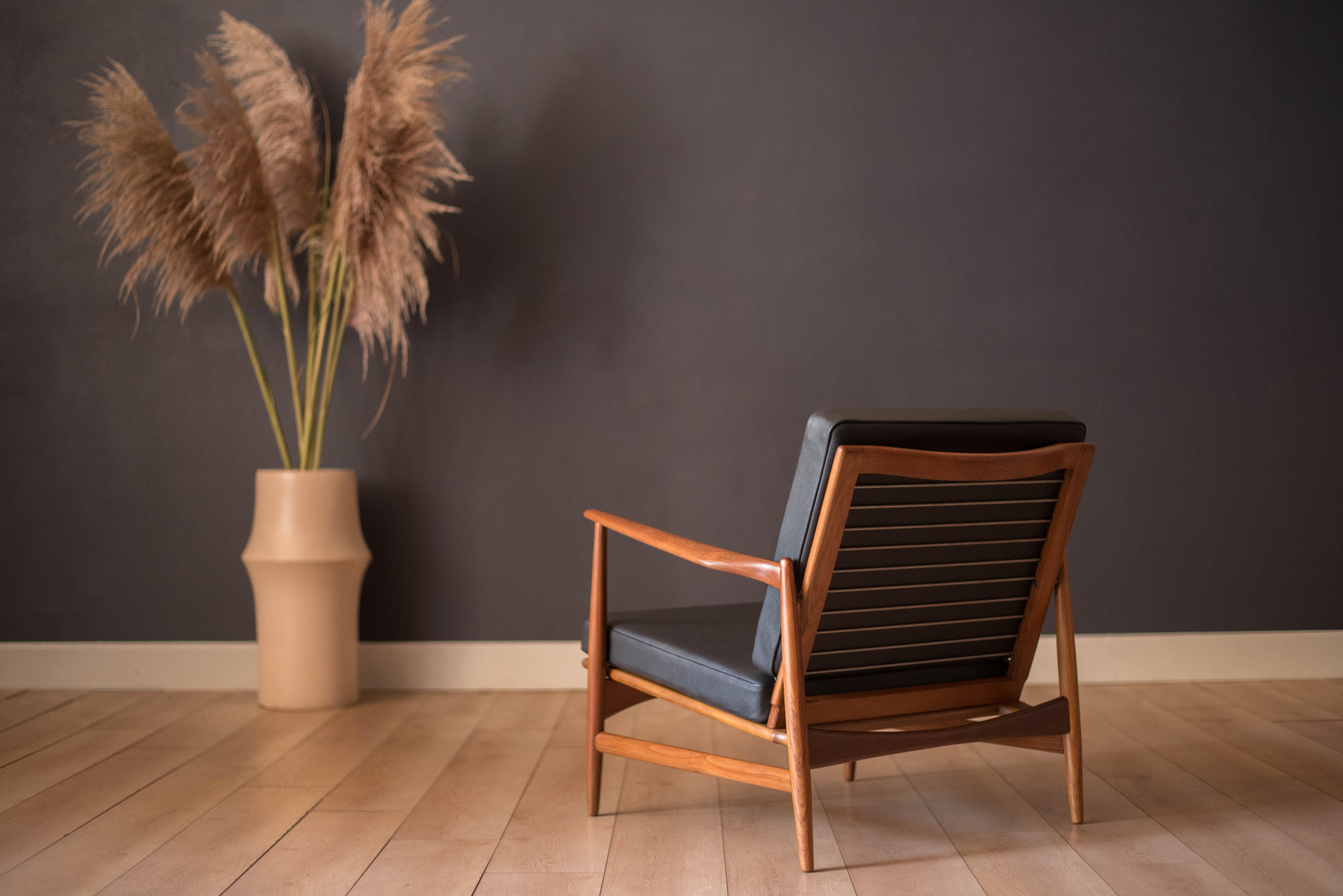 Danish Modern Teak and Black Leather Lounge Chair by Ib Kofod-Larsen for Selig 4