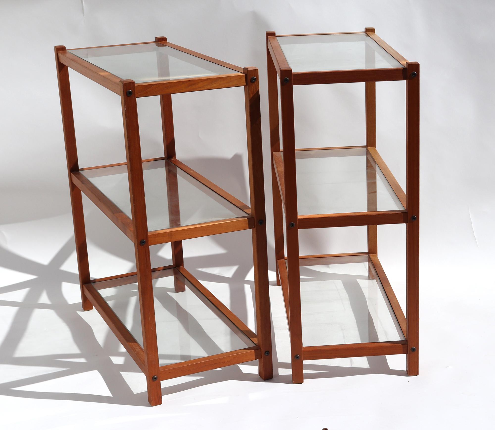 Danish Modern Teak and Glass Etageres,
1970s-80s

The Scandinavian Modern pair of teak and glass etageres each have three removable glass shelves.
 