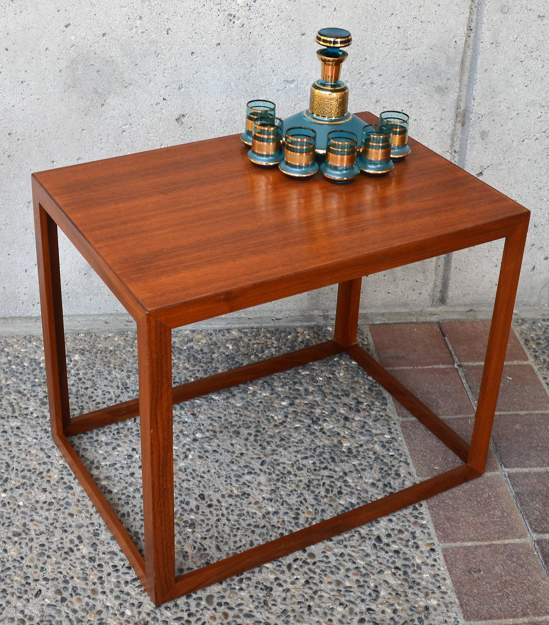This fabulous Danish modern teak and mahogany open airy table reminds me of when I first learned how to draw a 3D cube! Beautiful grain, design and mitered corner details - it's perfect as a large side table or a smaller coffee table. In gorgeous