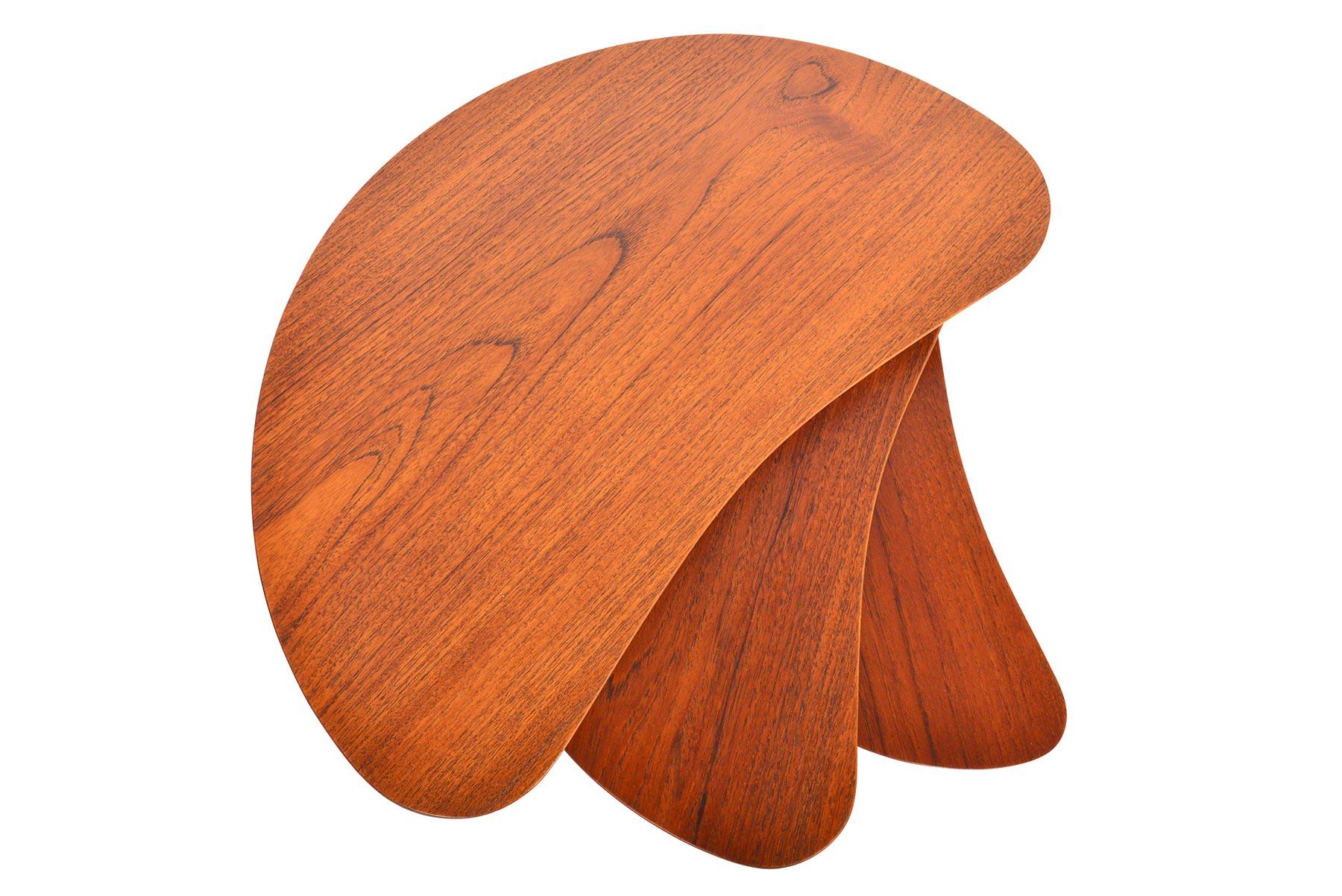 This rare set of Danish modern teak and oak nesting tables is crafted in a gorgeous organic crescent shape. Teak table tops are supported by quarter- sawn oak legs. In excellent original condition with typical wear for their vintage.

 