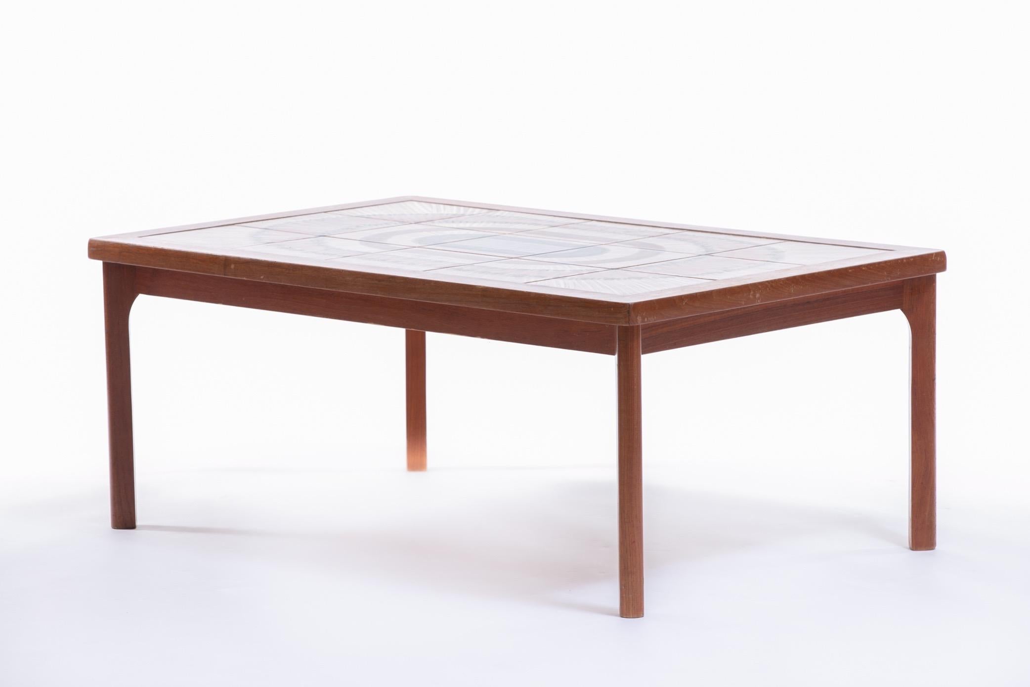 Unique vintage Danish modern teak coffee table made by Toften Mobelfabrik. Beautiful earth toned painted artistic tile - signed. Structurally sound with very minimal wear. No damage to tiles. Table is stamped by Toften Mobelfabrik. Want to see more