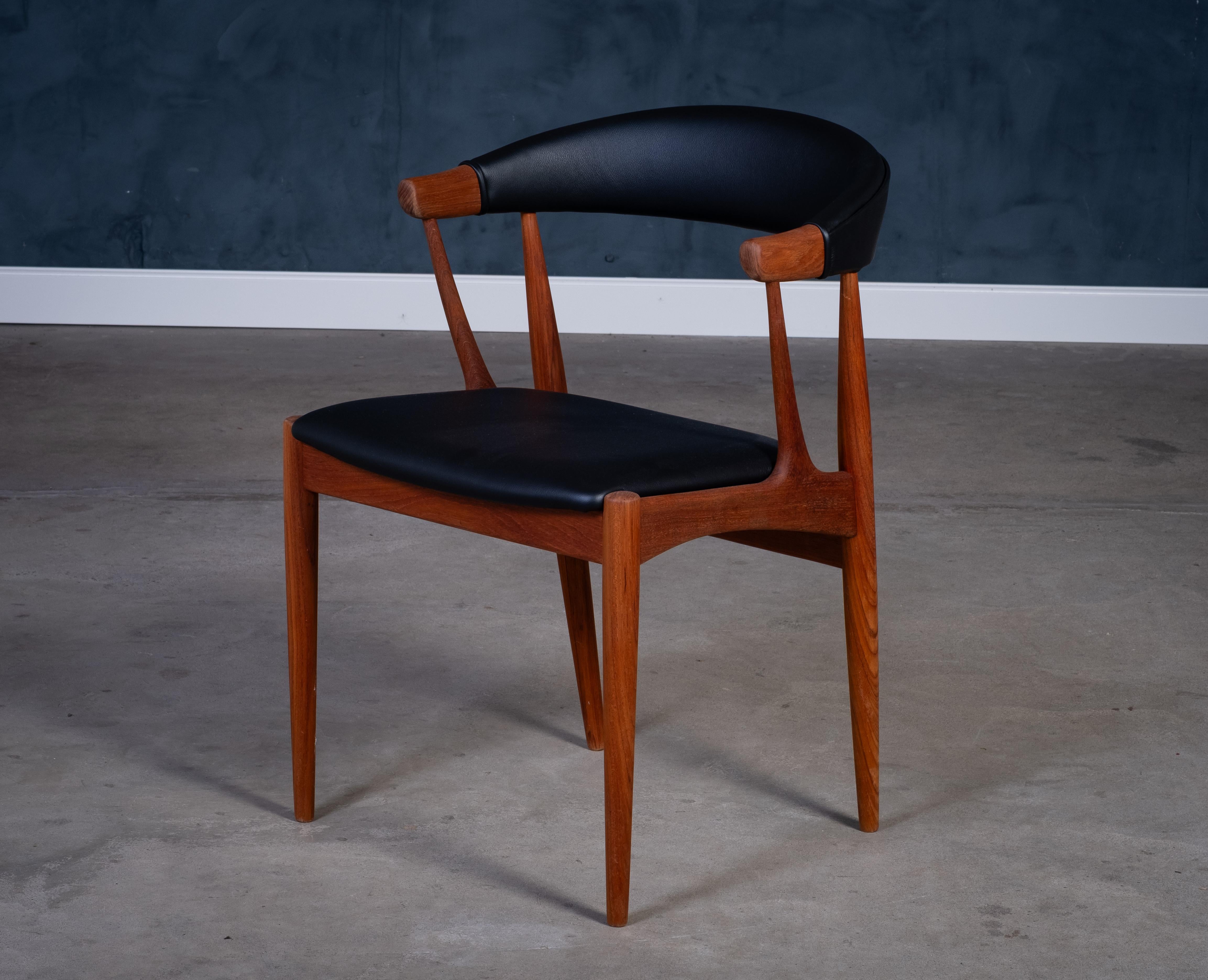 Precioso sillón moderno danés de teca, modelo BA113, diseñado por el arquitecto Johannes Andersen y fabricado por Brdr. Andersens Møbelfabrik, Vejen, en la década de 1960. Con un diseño escultural de líneas orgánicas, patas redondas cónicas de teca