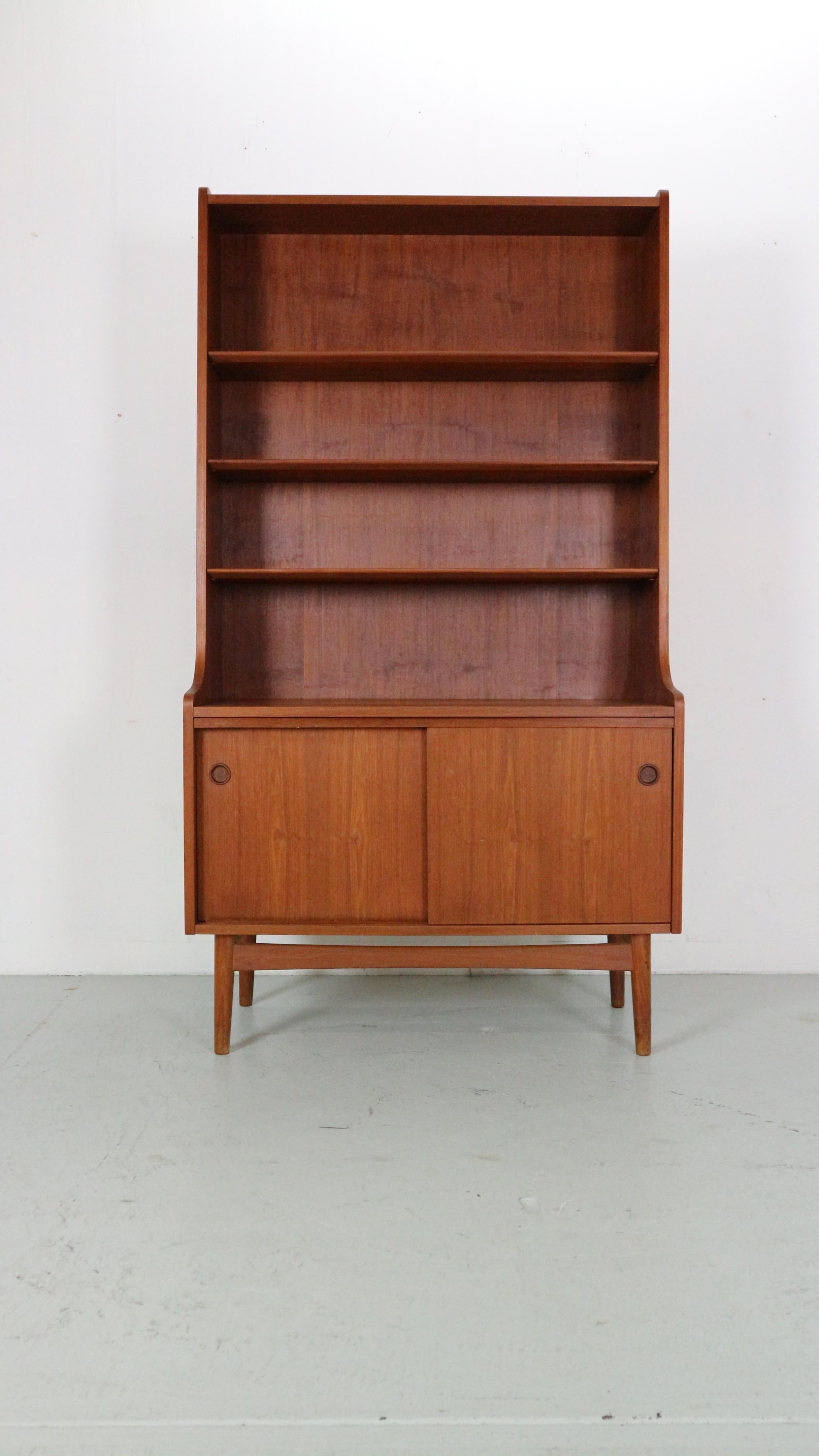This Classic Scandinavian bookcase was designed by Danish master carpenter Johannes Sorth for Nexø Møbelfabrik, Bornholm in 1956.

The idea was to combine a cabinet and a book case, and it was an instant success.
It was produced in five different
