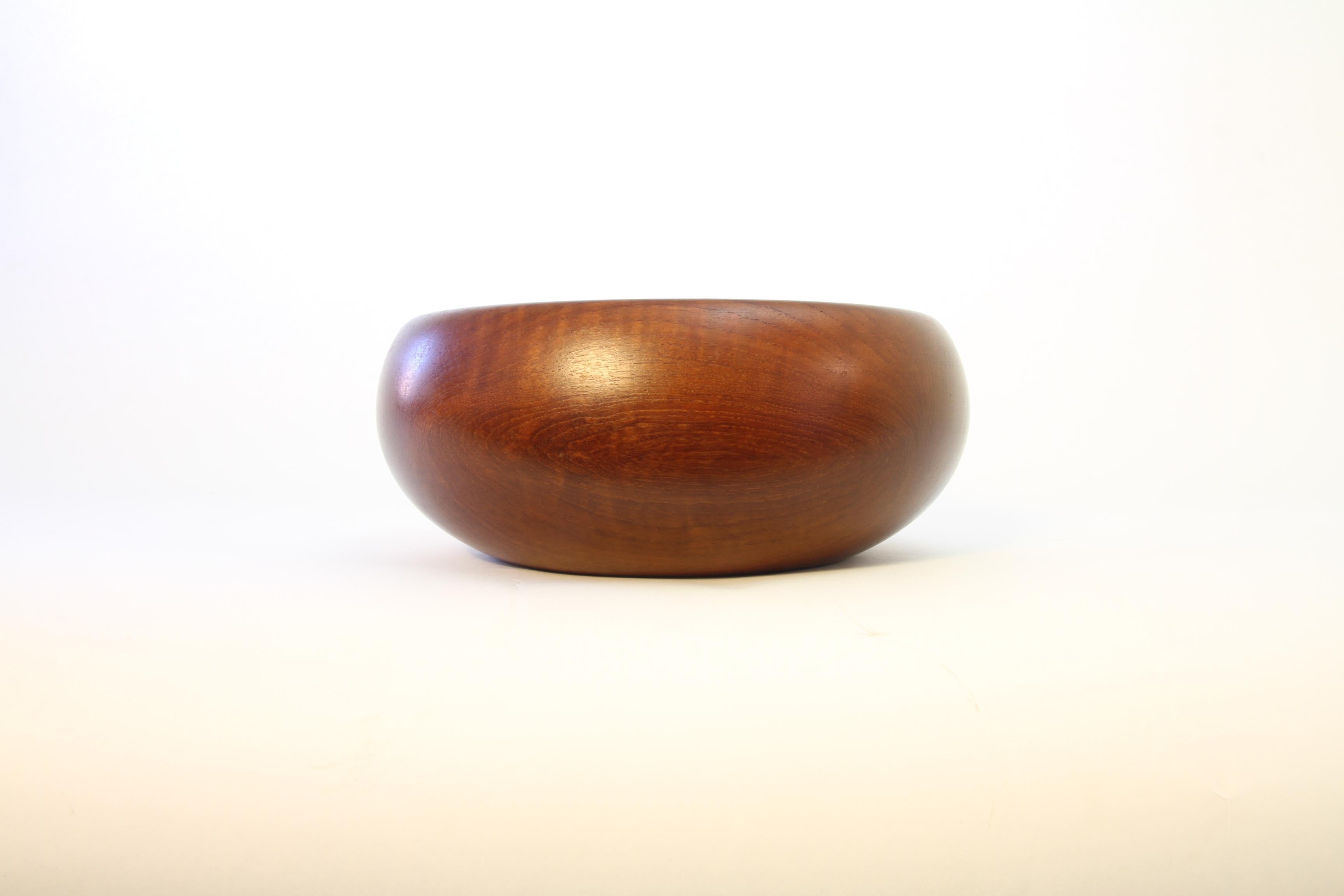 Beautiful organically shaped solid teak bowl made by Kay Bojesen in mint condition.