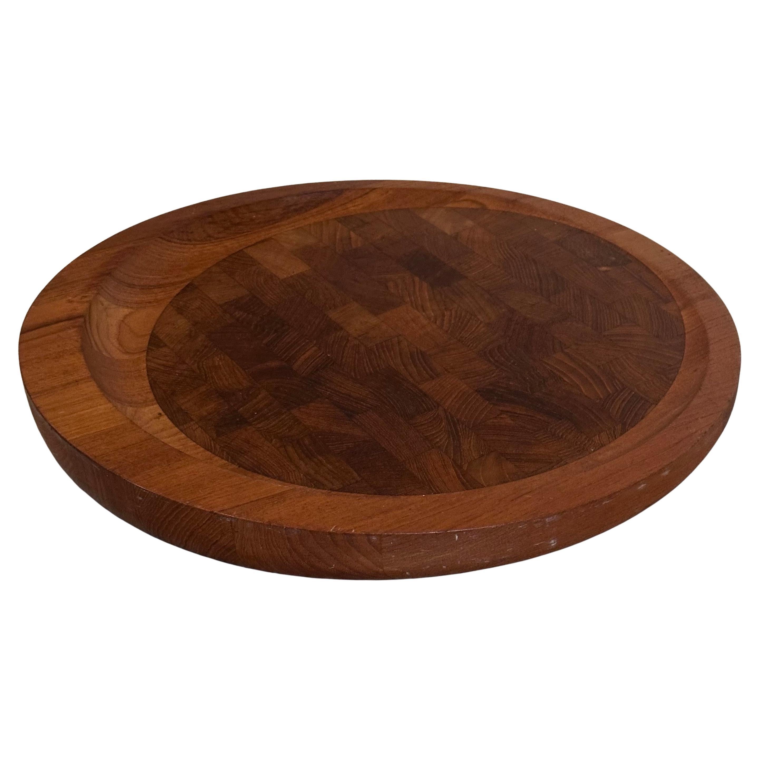 Danish modern teak butcher block round cutting board by Jens Quistgaard for Dansk, circa 1960s. The board is in very good vintage condition and measures 15.75