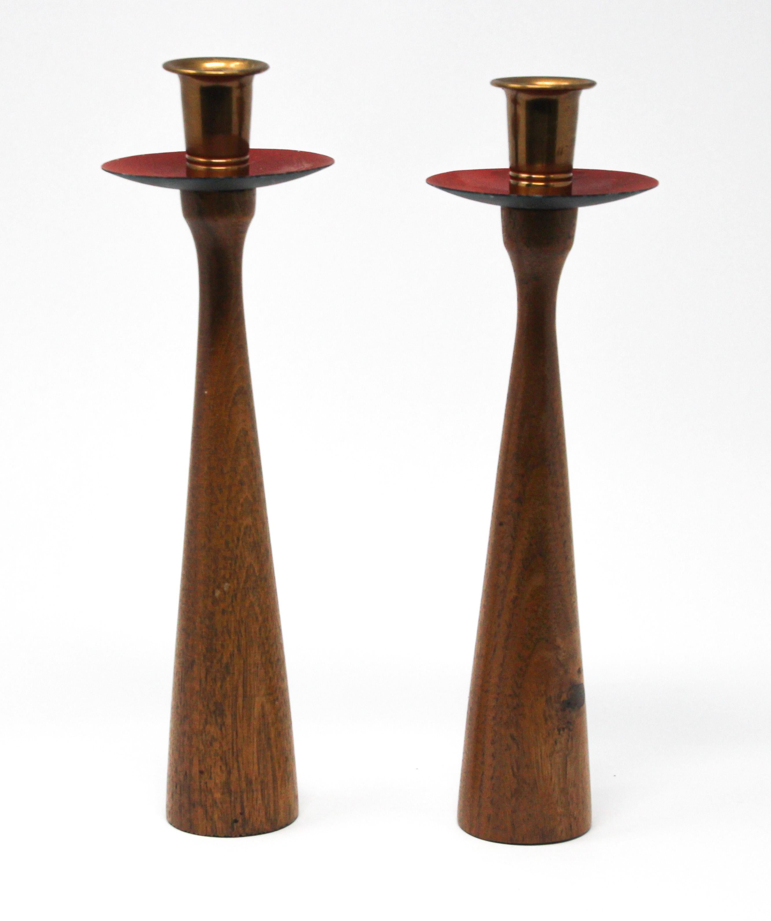 Midcentury Danish modern teak and brass candleholders in Rude Osolnik style.
Midcentury handcrafted teak candlestick holders.
These elegant candlesticks are unique and are in excellent vintage condition.
Vintage teak pair of candle holders with