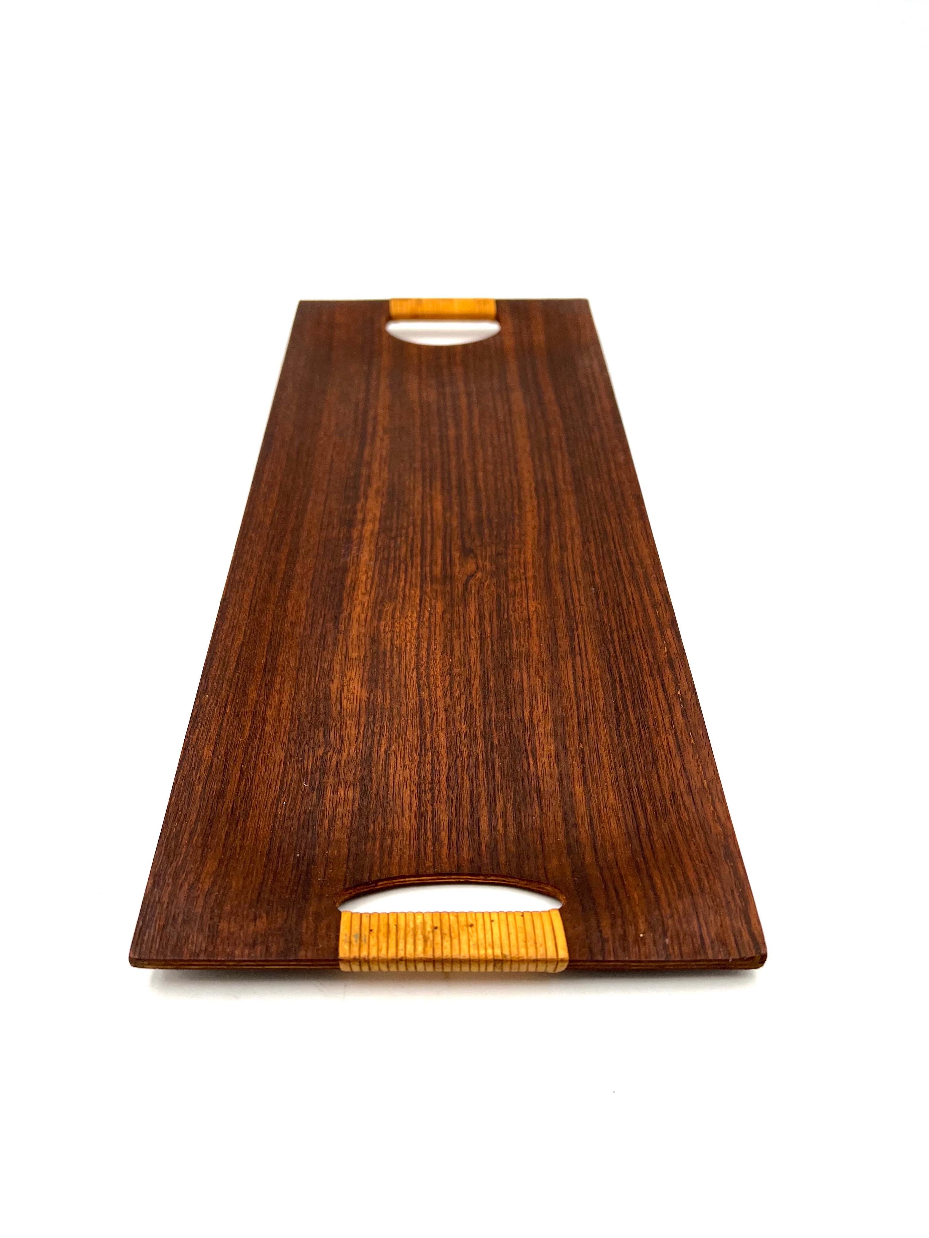 Beautiful and rare molded teak tray with cane handles simple delicate design, we have cleaned and oiled this beautiful and unique piece.