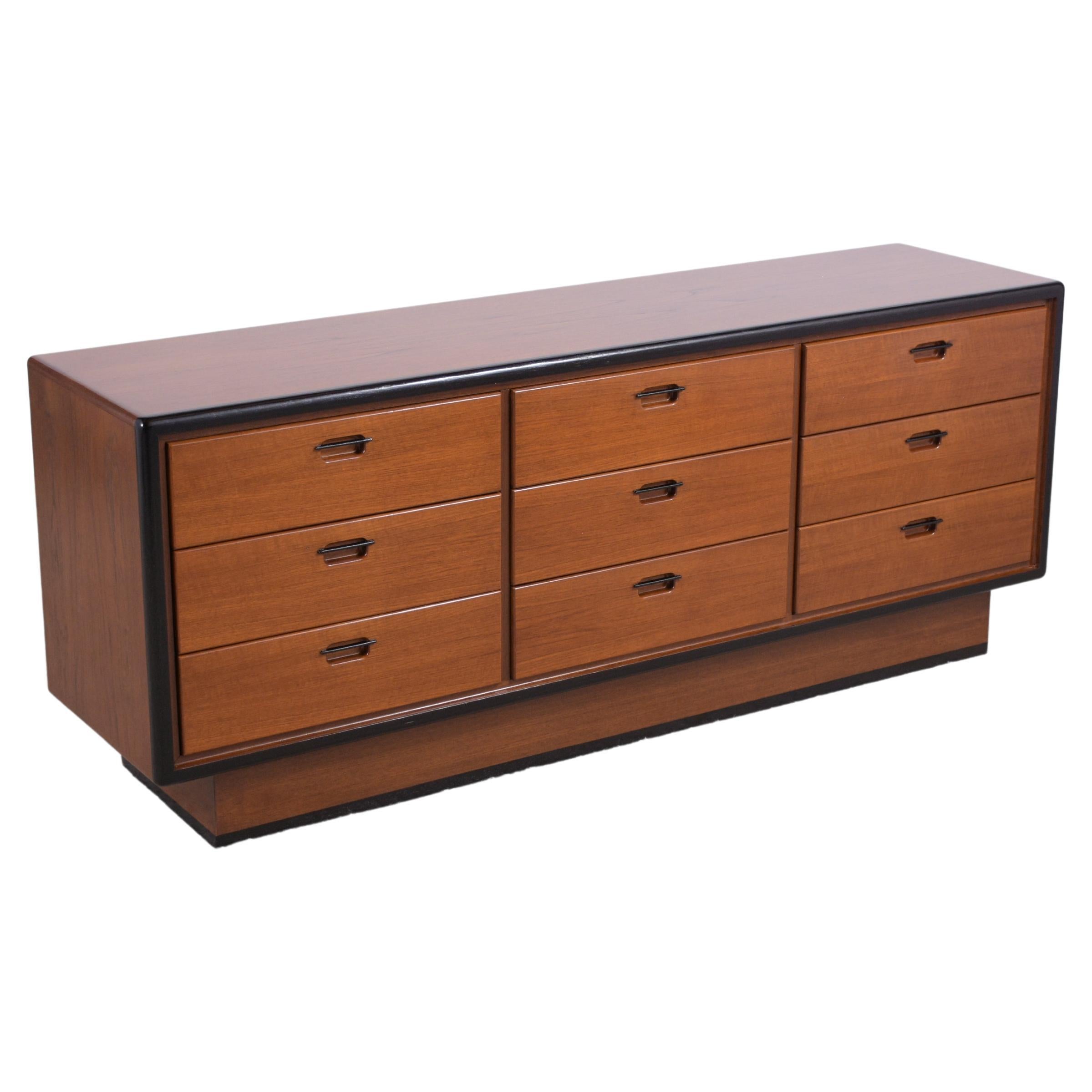 Immerse yourself in the allure of our 1960s Danish Mid-Century Modern Chest of Drawers, a testament to timeless craftsmanship and design. Meticulously handcrafted from the finest teak and veneer, this piece stands out for its remarkable condition