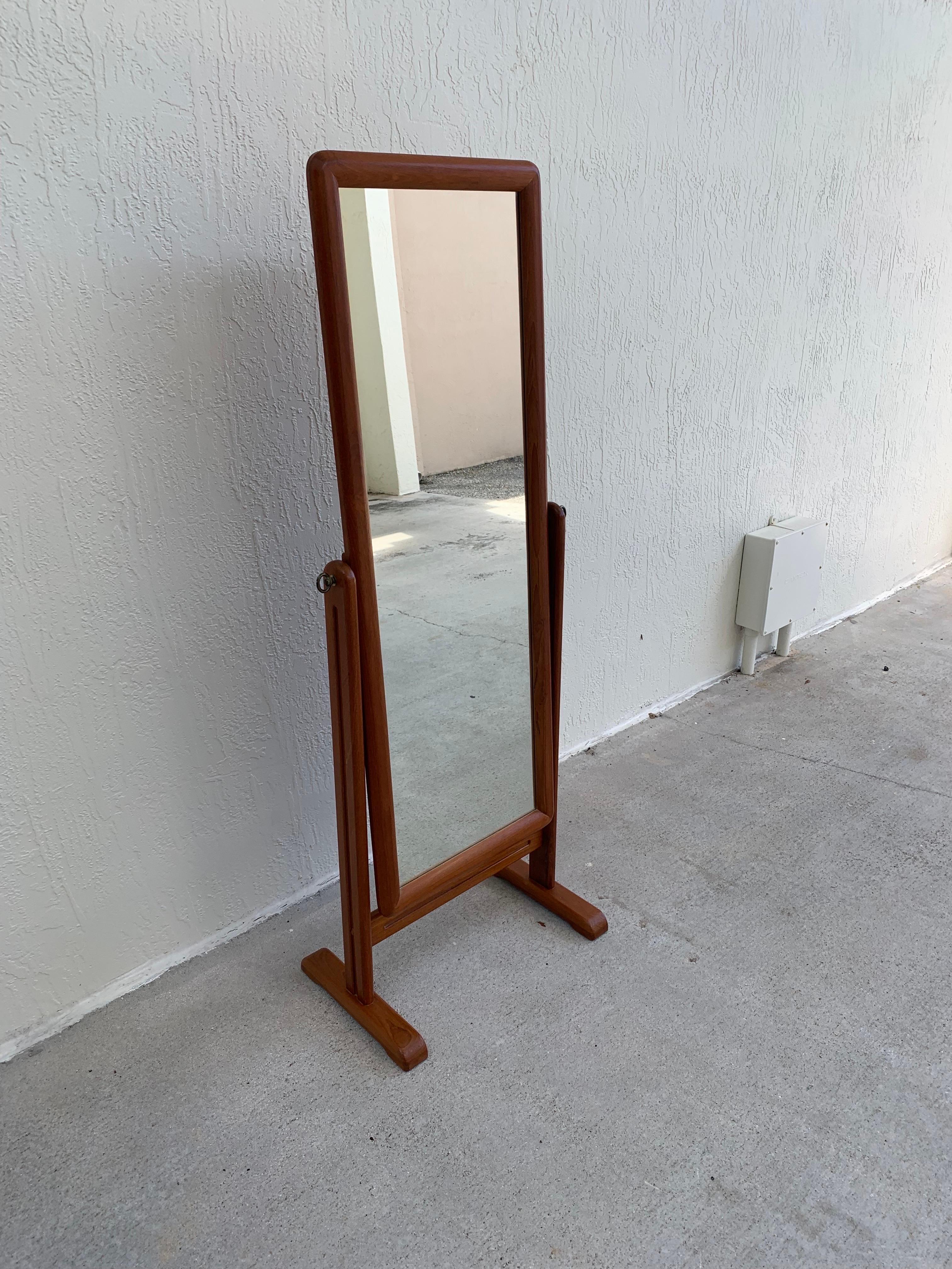 Mid-Century Modern cheval mirror. Danish modern in style and made sports a frame made of teak. 

Measures 60” tall 23” wide and 14” deep. 

Total mirror size is 50.5” tall and 18.5” wide.