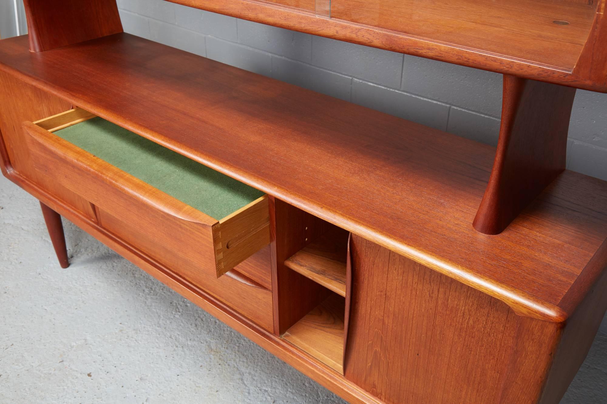 Two-tiered teak china cabinet and sideboard / credenza by H.P. Hansen. Two tambour doors.