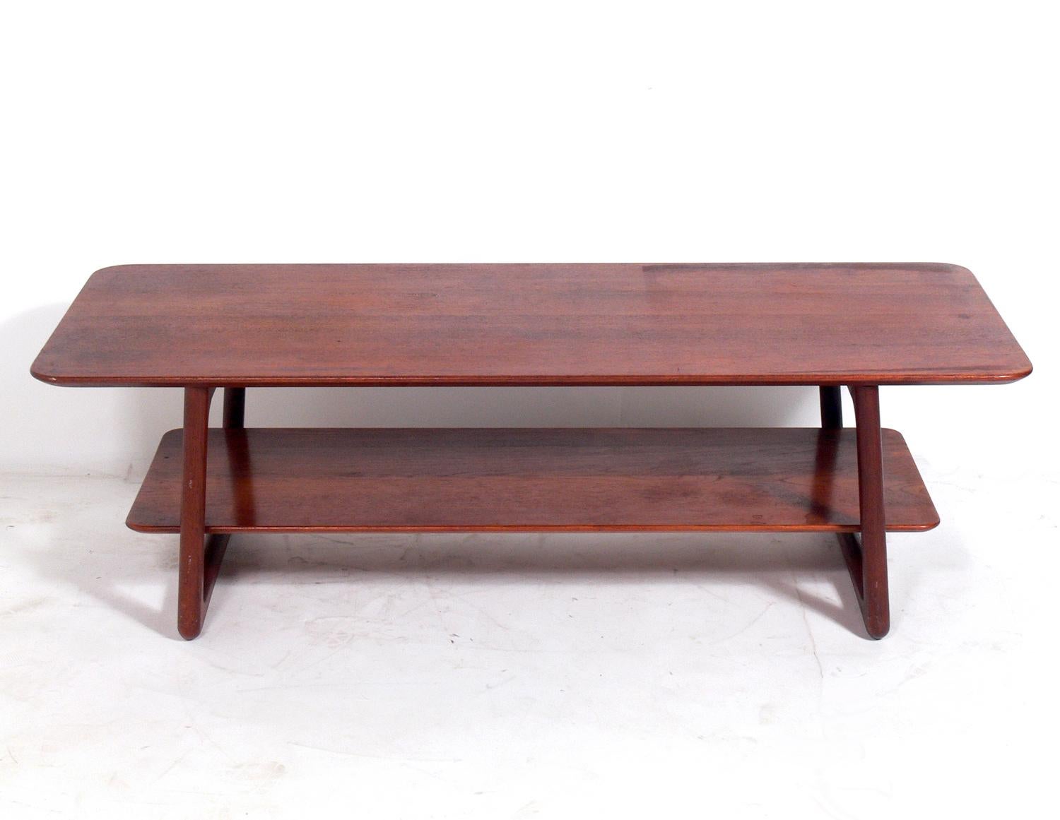 Danish modern teak coffee table, designed by Peter Hvidt & Orla Mølgaard Nielsen, Denmark, circa 1960s. This table is currently being refinished and will look wonderful when completed. The price noted includes refinishing.