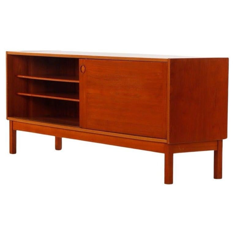 Scandinavian Modern Danish Modern teak credenza with sliding doors by ib Kofod Larsen For Sale