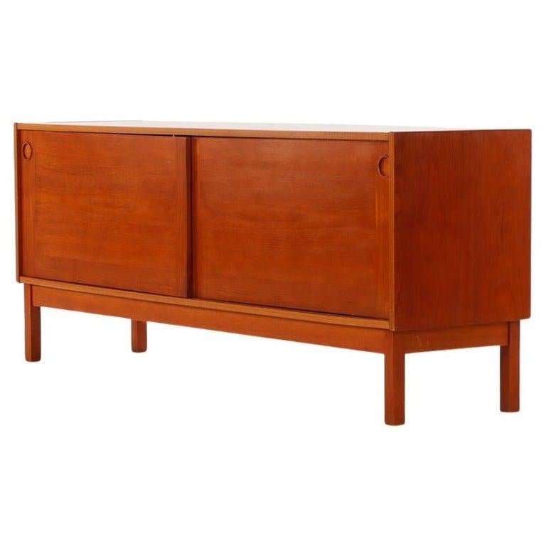 Danish Modern teak credenza with sliding doors by ib Kofod Larsen In Good Condition For Sale In Brooklyn, NY