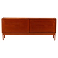 Danish Modern teak credenza with sliding doors by ib Kofod Larsen