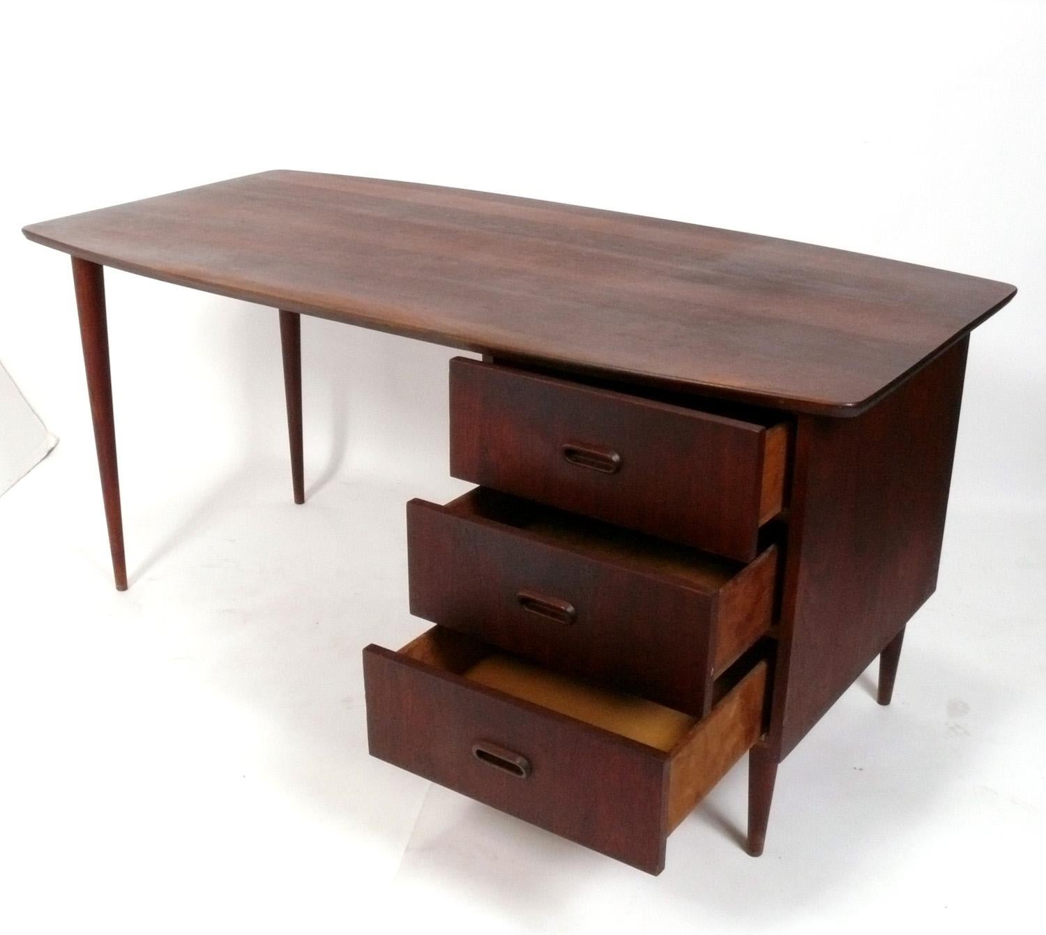 Clean Lined Danish Modern Teak Desk, Denmark, circa 1960s. It has been cleaned and Danish oiled and is ready to use. Three deep drawers for lots of storage. 