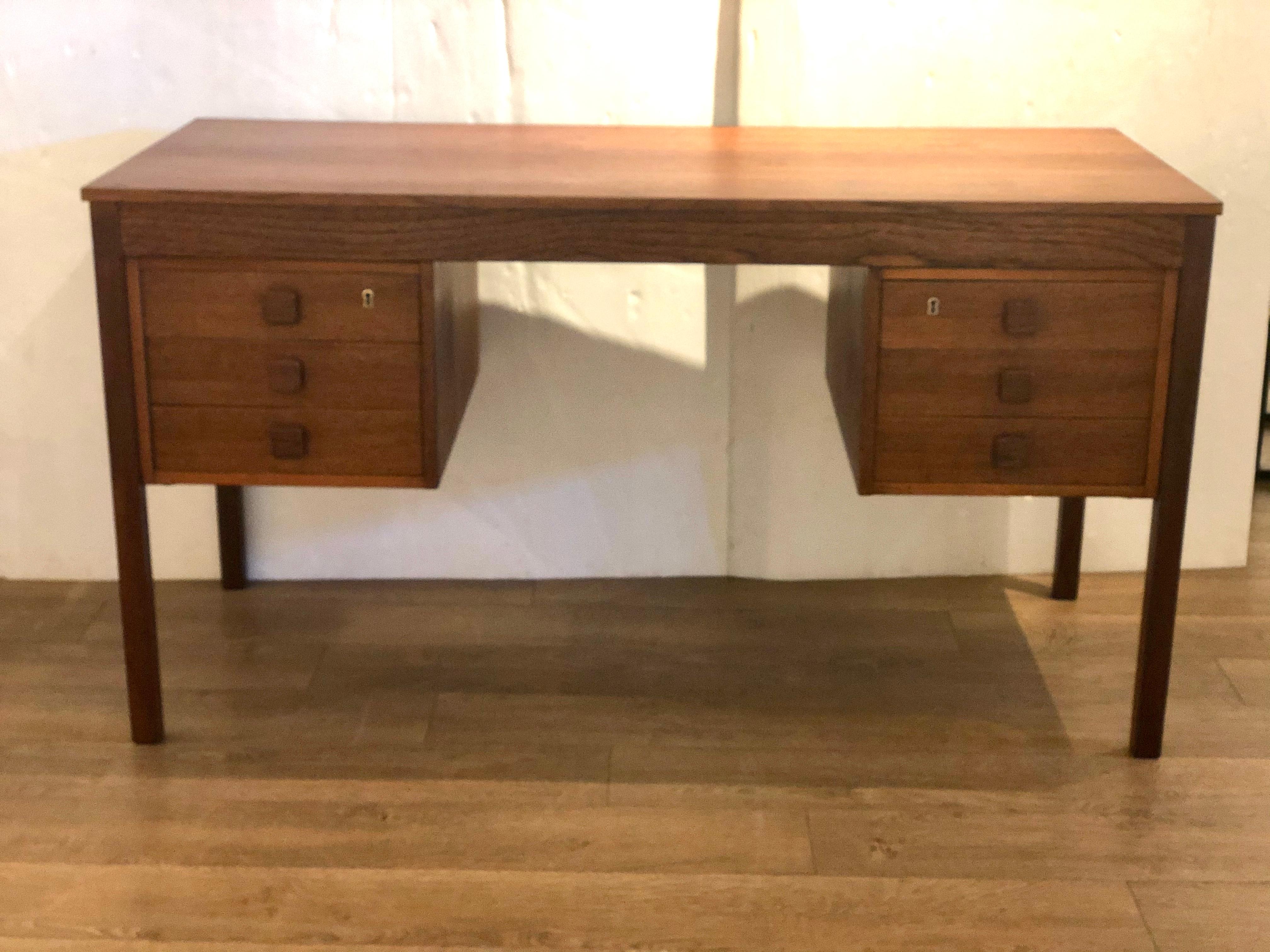 Simple elegant Danish teak desk circa 1970s, freshly refinished, with six drawers there is a key slot but the key its missing, versatile and stylish. Finished on both sides.
