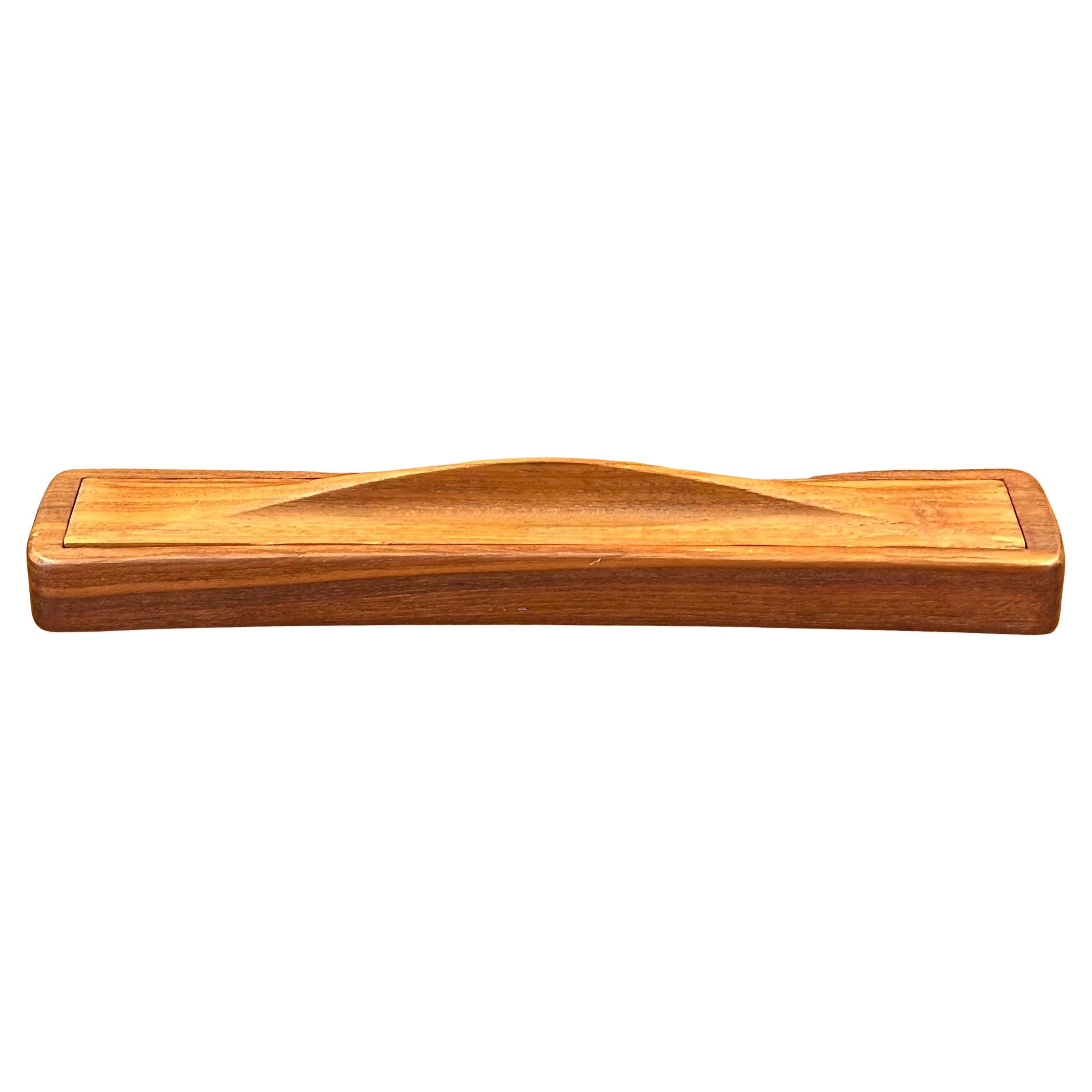 A super cool and very hard-to-find Danish modern teak desk organizer box by Jens Quistgaard for Dansk, circa 1970s. The box has a removable lid and three compartments for storage.  Gorgeous wood grain and patina on this piece which is in very good