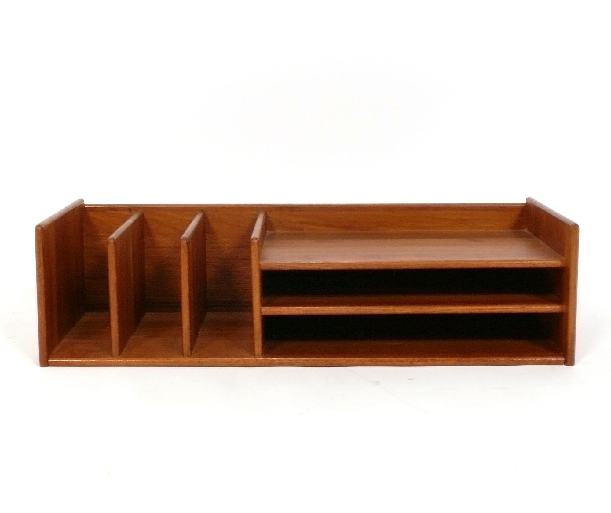 Danish Modern Teak Desk Organizer, designed by George Petersens, Denmark, circa 1960s. It's a new year and a great time to get organized! This features two side shelves on the right and three storage or letter compartments on the left. It is fully