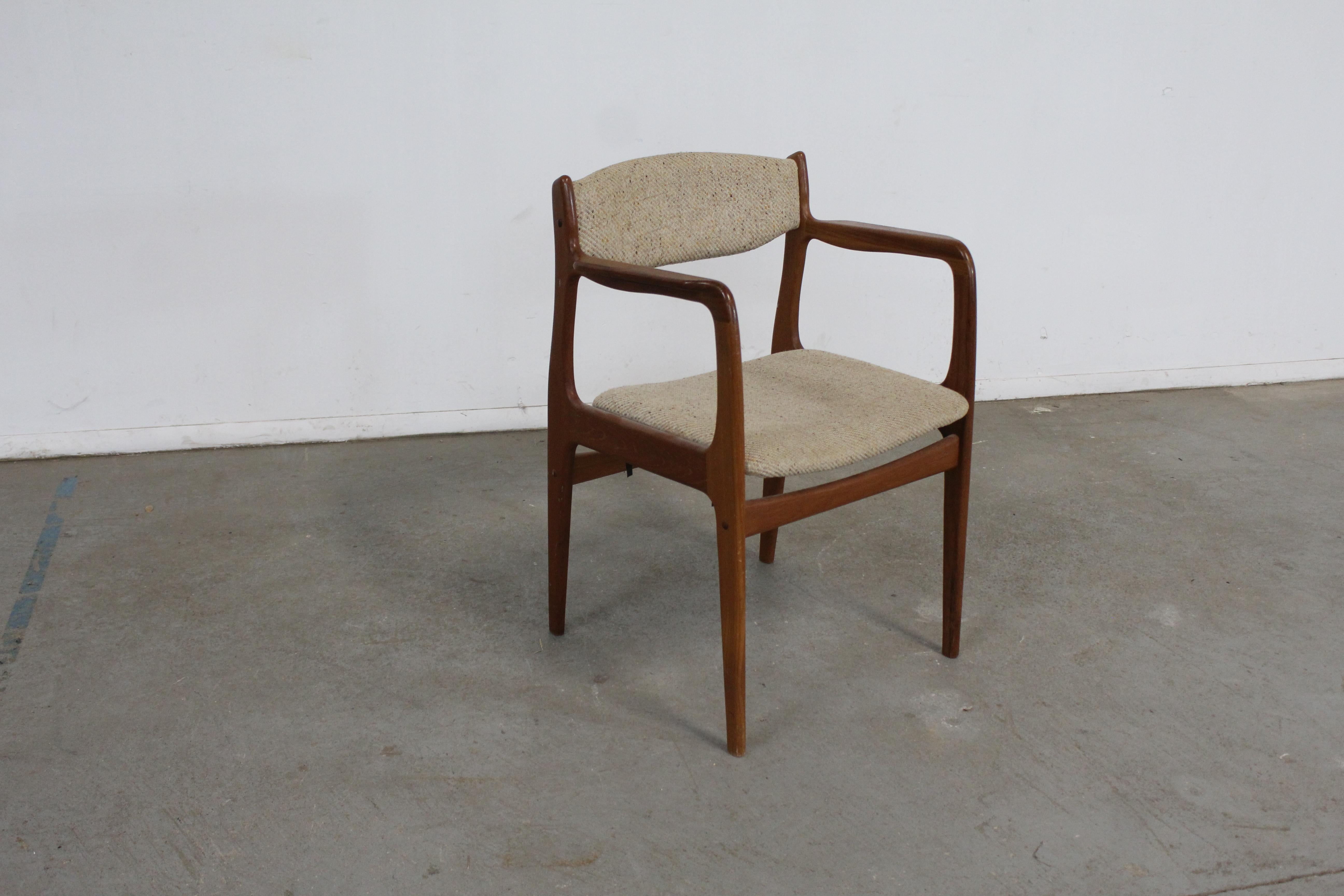 Danish Modern teak arm dining chair

 Offered is a Danish Modern teak arm dining chair. This armchair has simple, but modern lines and could make an excellent addition to any set. The chair looks to be Eric Buch, but is unsigned. The is in good