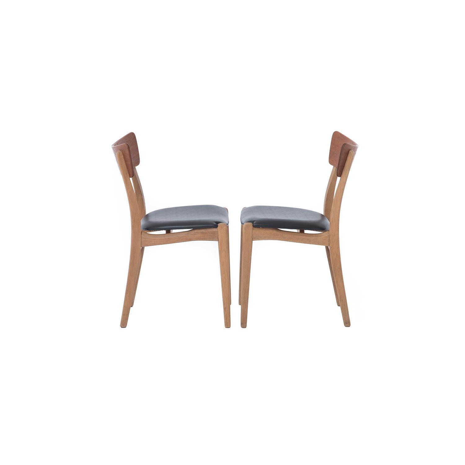 Teak and oak combine to create clean lines complimented with a swooping bowtie back. Six chairs included in the set.