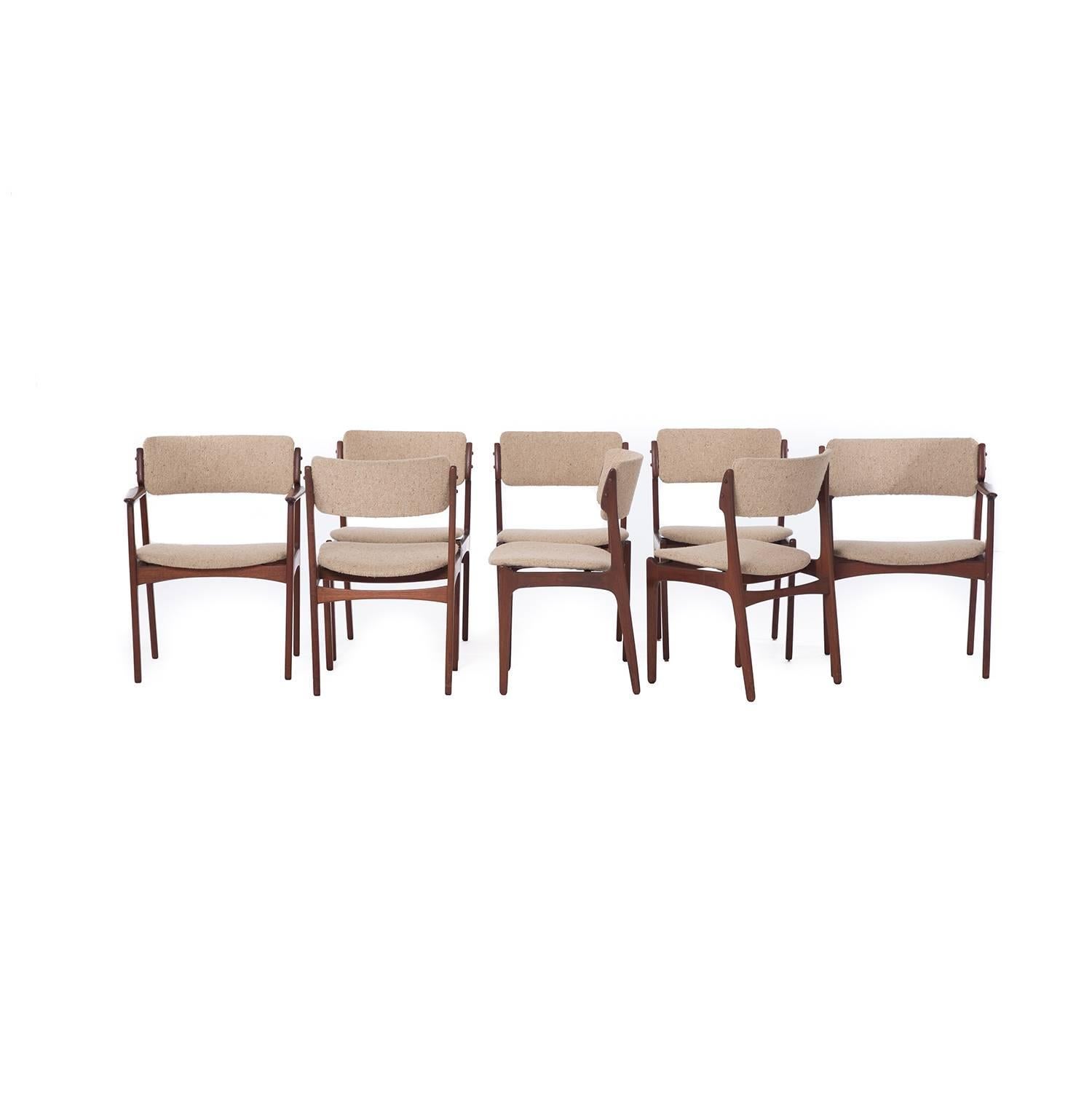 This set of eight-teak Erik Buch chairs includes two-arm chairs and six side chairs.