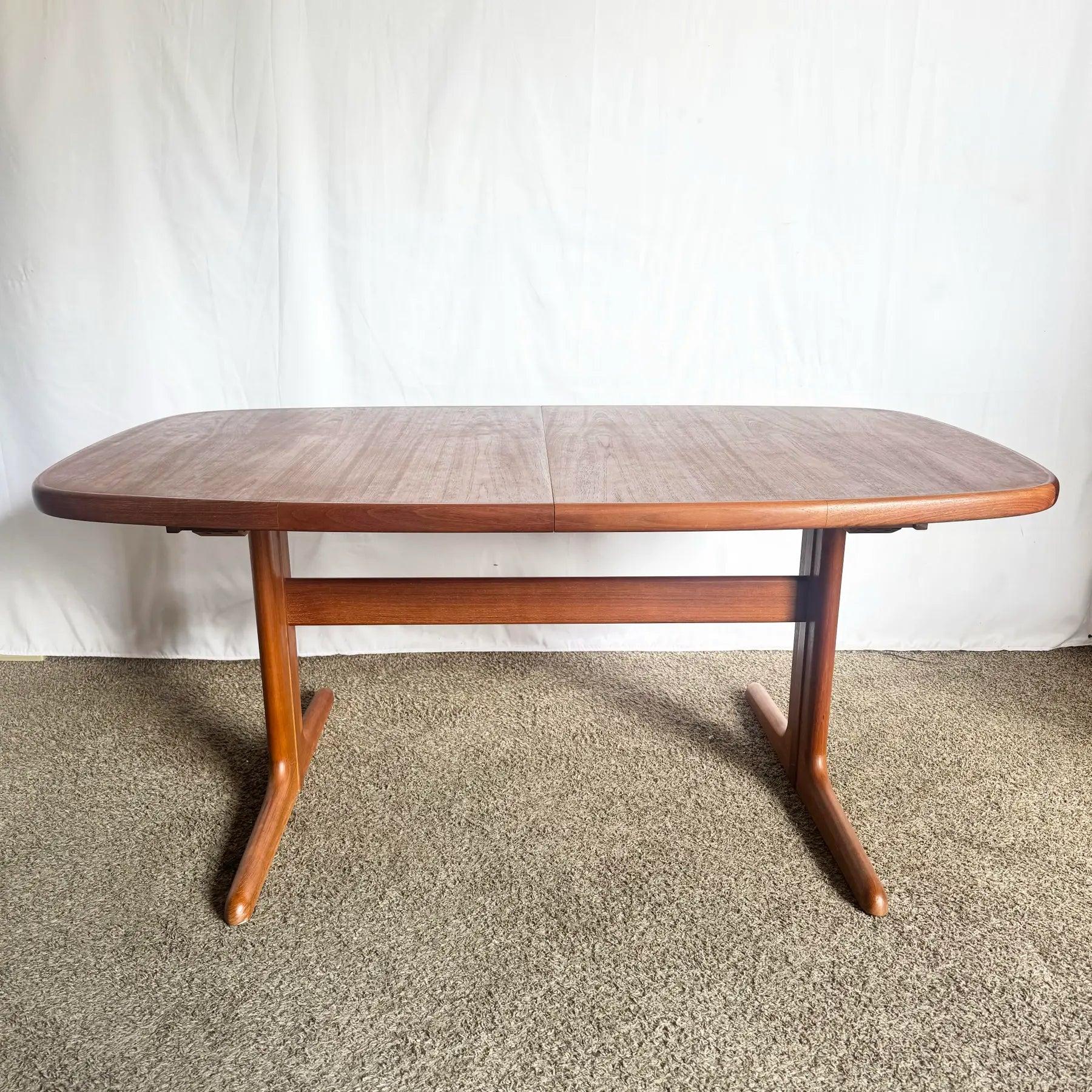 Elevate your dining space with this Skovby Danish Modern Teak Table—sculptural pedestal base, smooth grain, and refined Scandinavian design.
 

 Some age to the surface as can be seen in the photos.
 

 We sell items as acquired, without restoring
