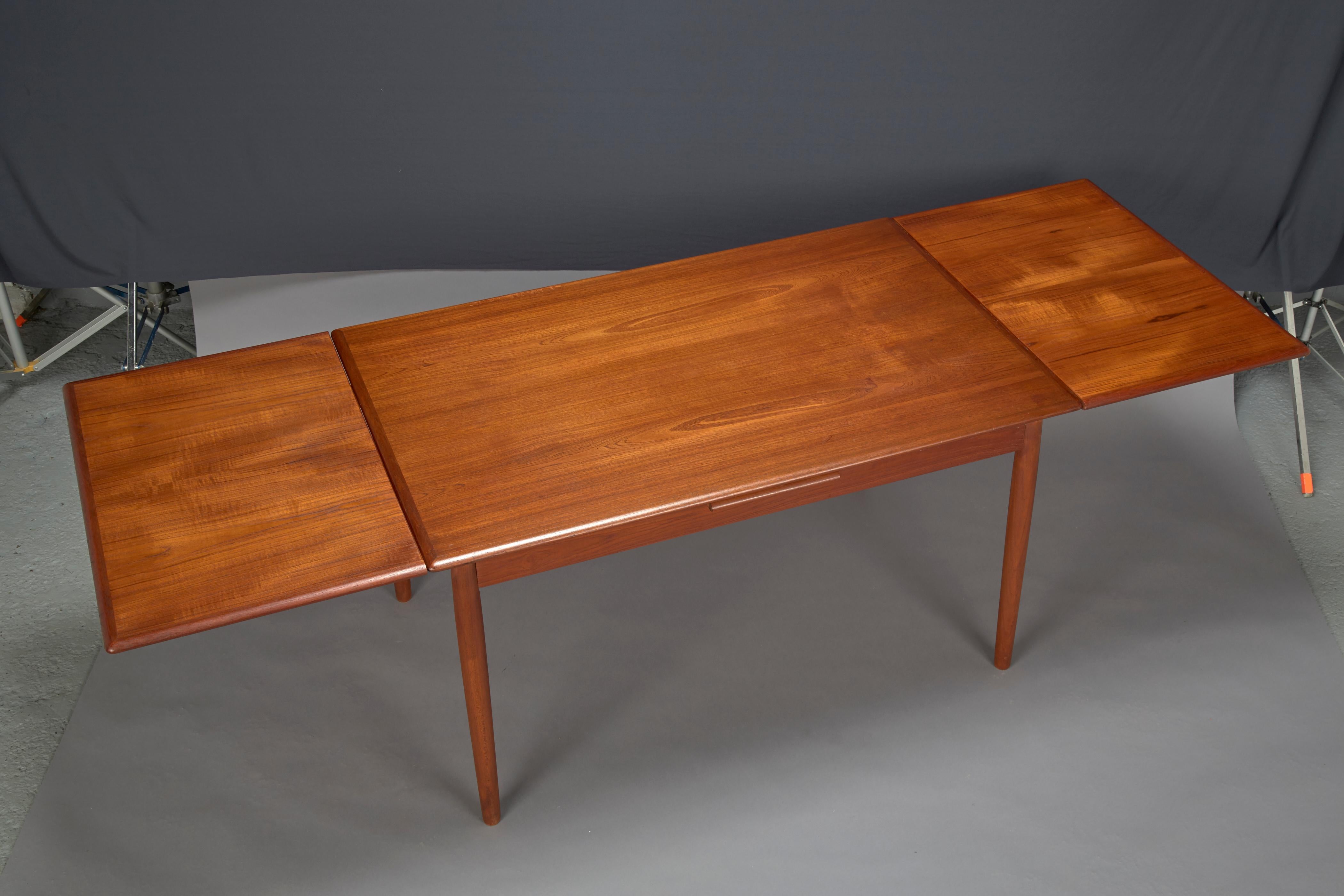 Mid-Century Modern Danish Modern Teak Dining Table With Two Pull-out Leaves