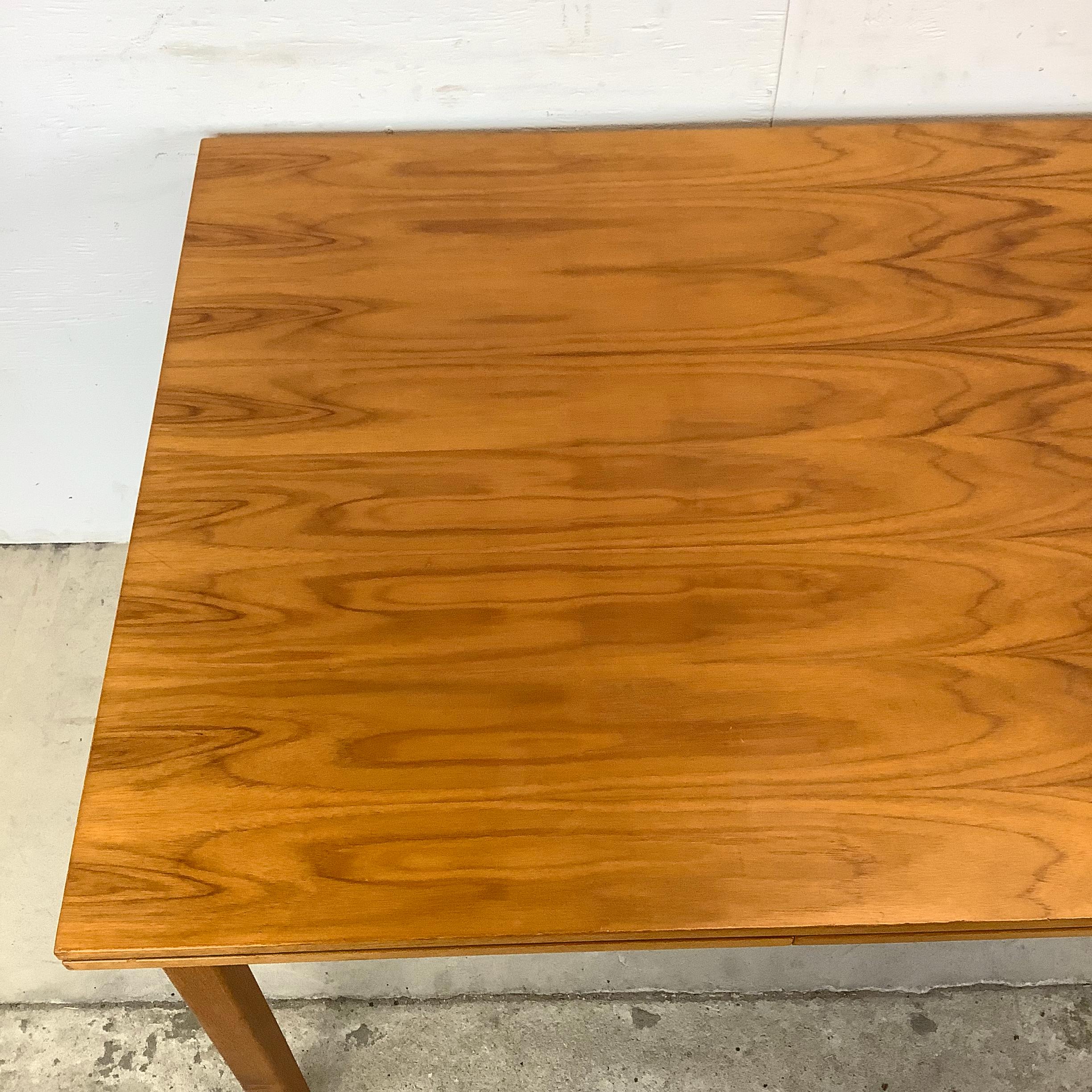Discover the timeless elegance of Scandinavian Modern design with this vintage teak dining table by Furbo Brdr. of Denmark. Crafted with impeccable attention to detail, this dining table exemplifies the sophisticated minimalism that Danish furniture