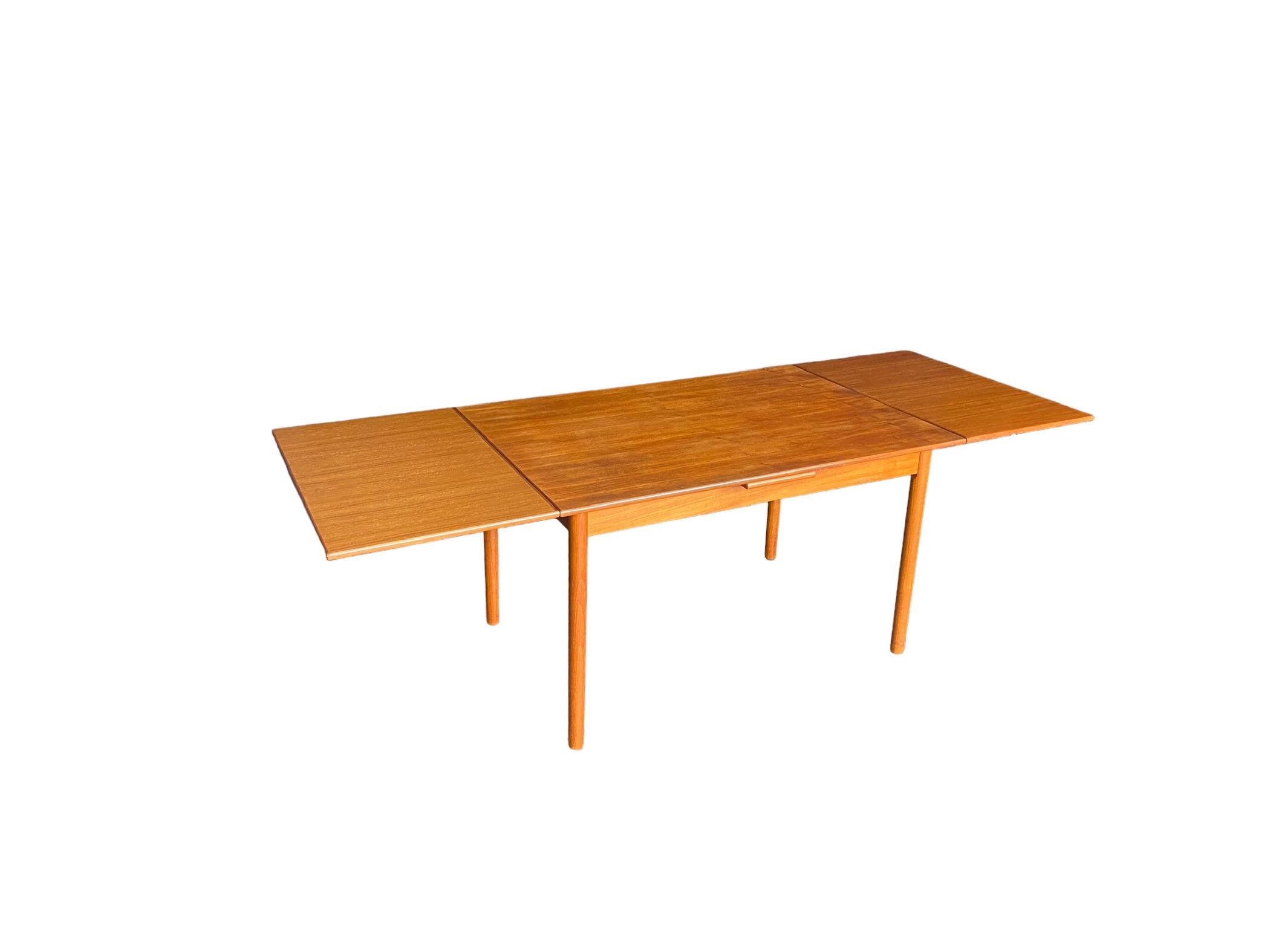 Danish Modern Teak Draw Leaf Dining Table In Fair Condition For Sale In Brooklyn, NY