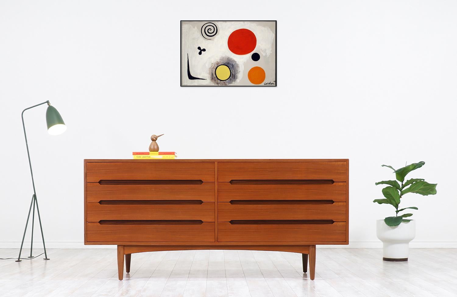 Elegant modern dresser designed and manufactured by E.W. Bach in Denmark circa 1950s. This Danish Modern teak dresser features eight drawers with dovetailed joinery and carved pulls showcasing impeccable craftsmanship, bringing a beautiful
