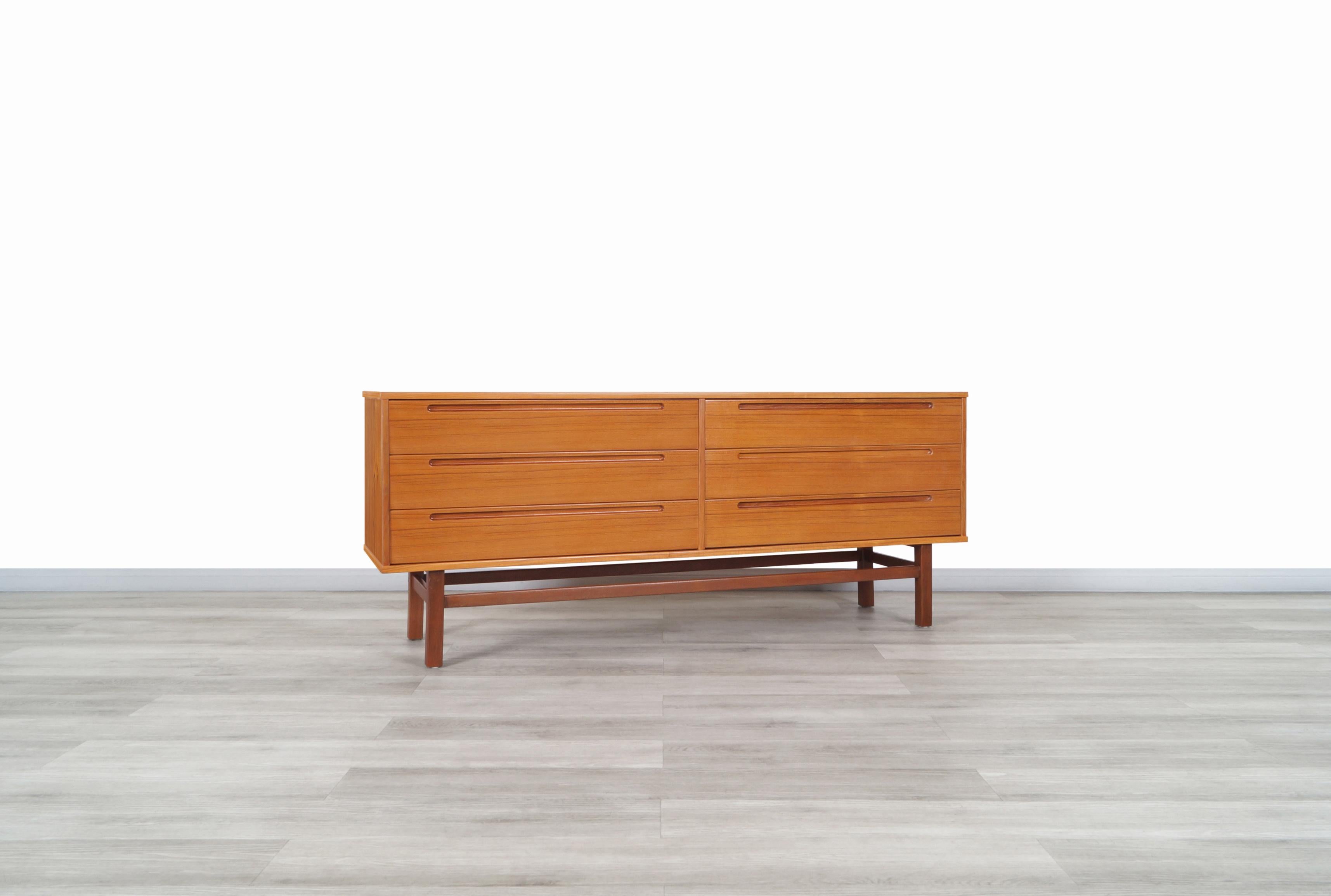 Exceptional Danish modern teak dresser designed by Nils Jonsson for HJN Møbler in Sweden, circa 1960s. This dresser has been constructed from fine teak wood and features a minimalist yet highly functional design. Features a total of 6 large drawers