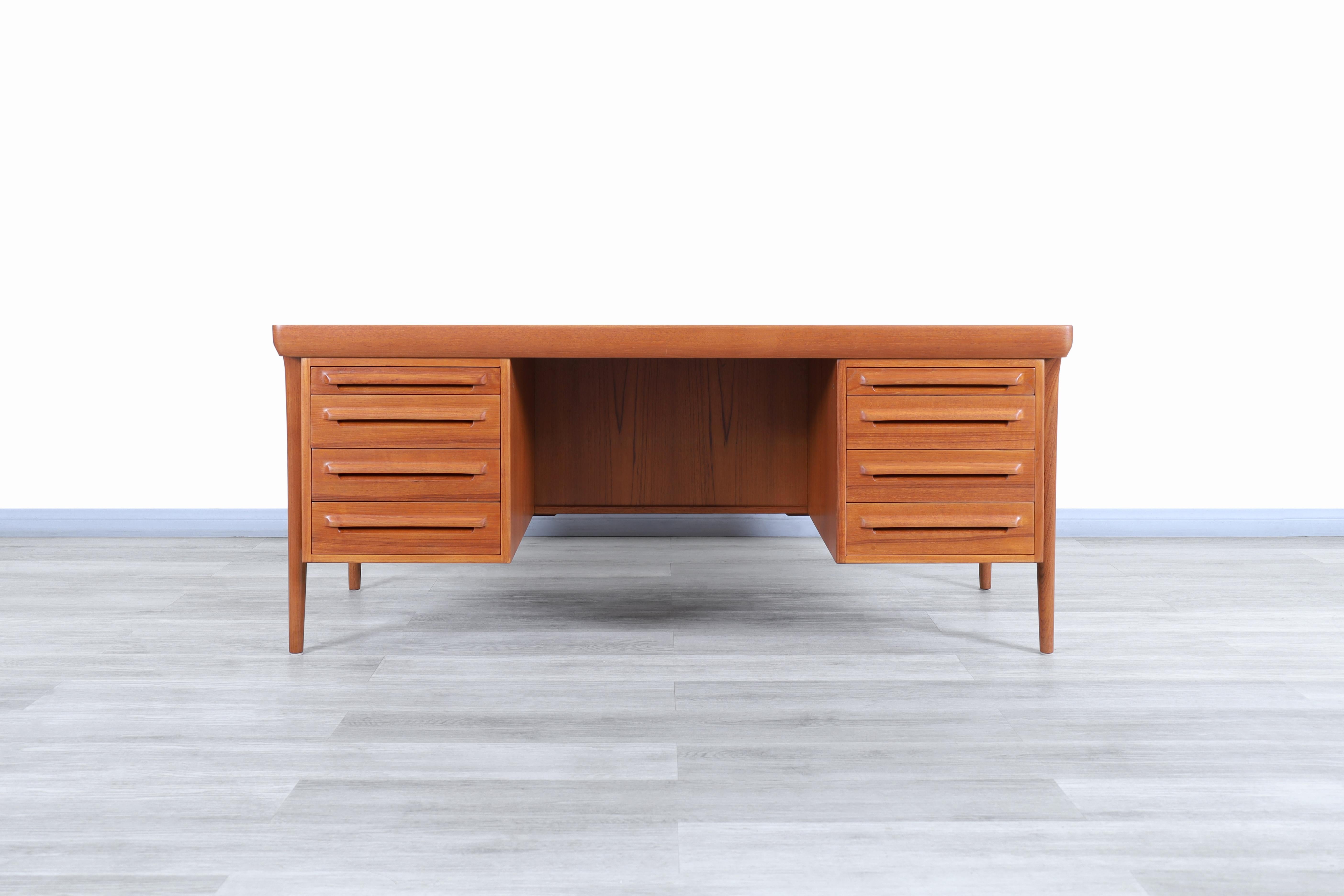 Amazing Danish teak executive desk designed by Ib Kofod Larsen for Faarup Møbelfabrik in Denmark, circa 1960s. This desk has a versatile and functional design. fine attention to detail can be seen in the construction expressed through the entire