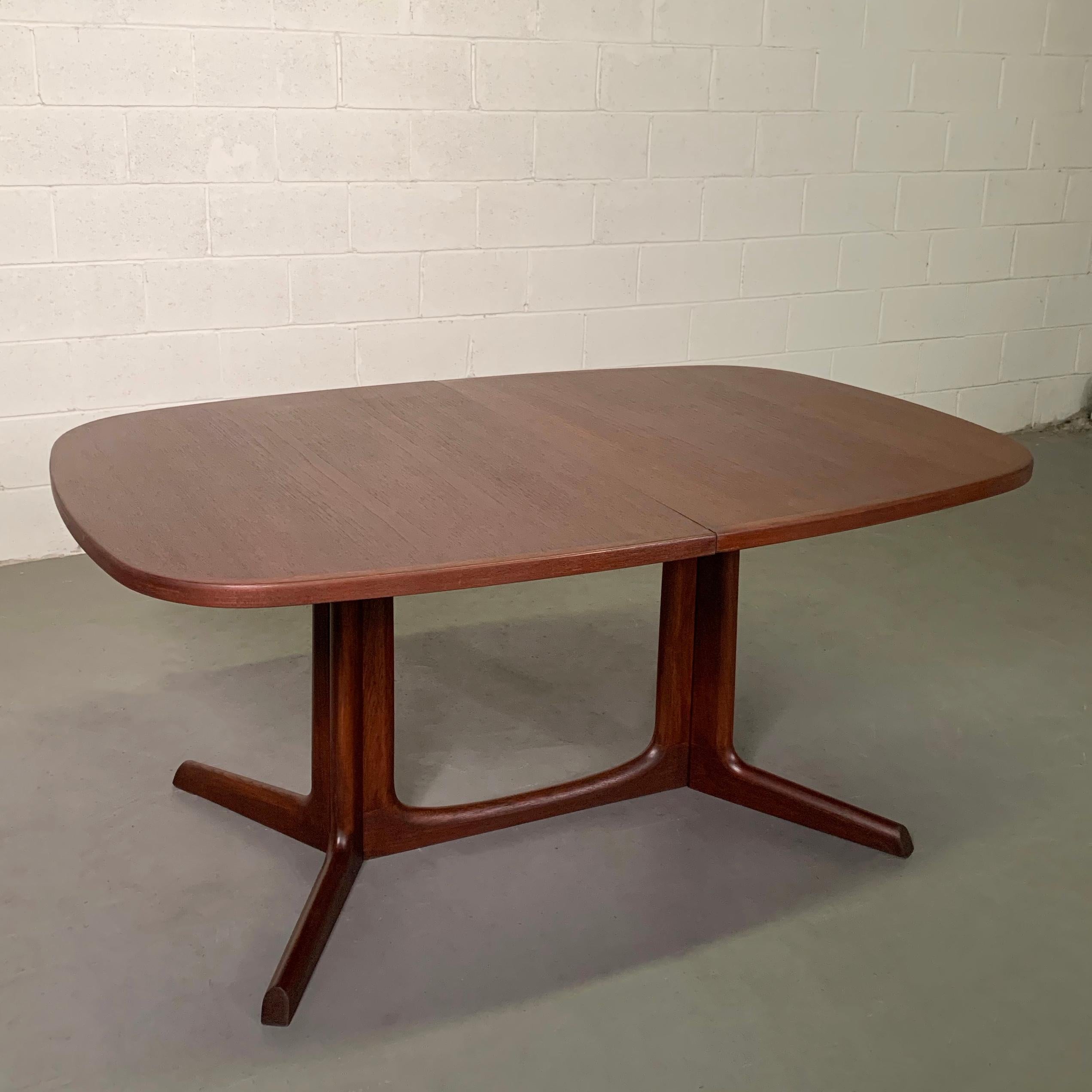 Danish modern, solid teak, extension dining table designed by Niels O. Moller for Gudme Mobilfabrik features rounded edges and a sculptural base. The table has two 19 inch leaves that can extend the table up to 101 inches.