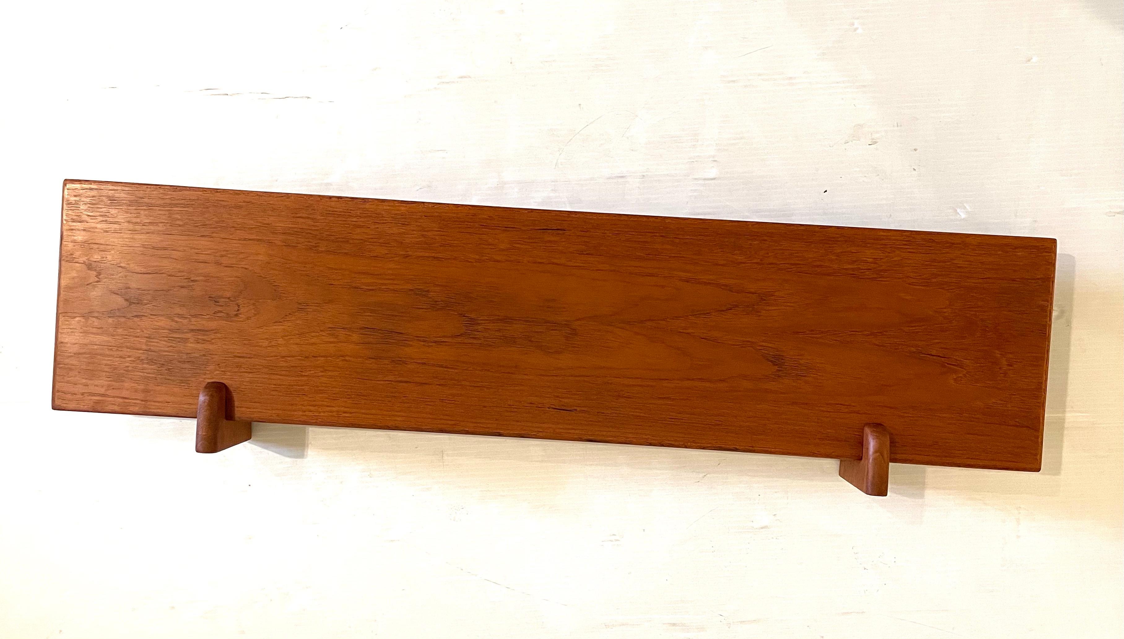 beautiful simple design well crafted floating shelf designed by Aksel Kjersgaard , circa 1950's we have oiled and cleaned the piece, beautiful dovetail drawer, and easy to install as shown.