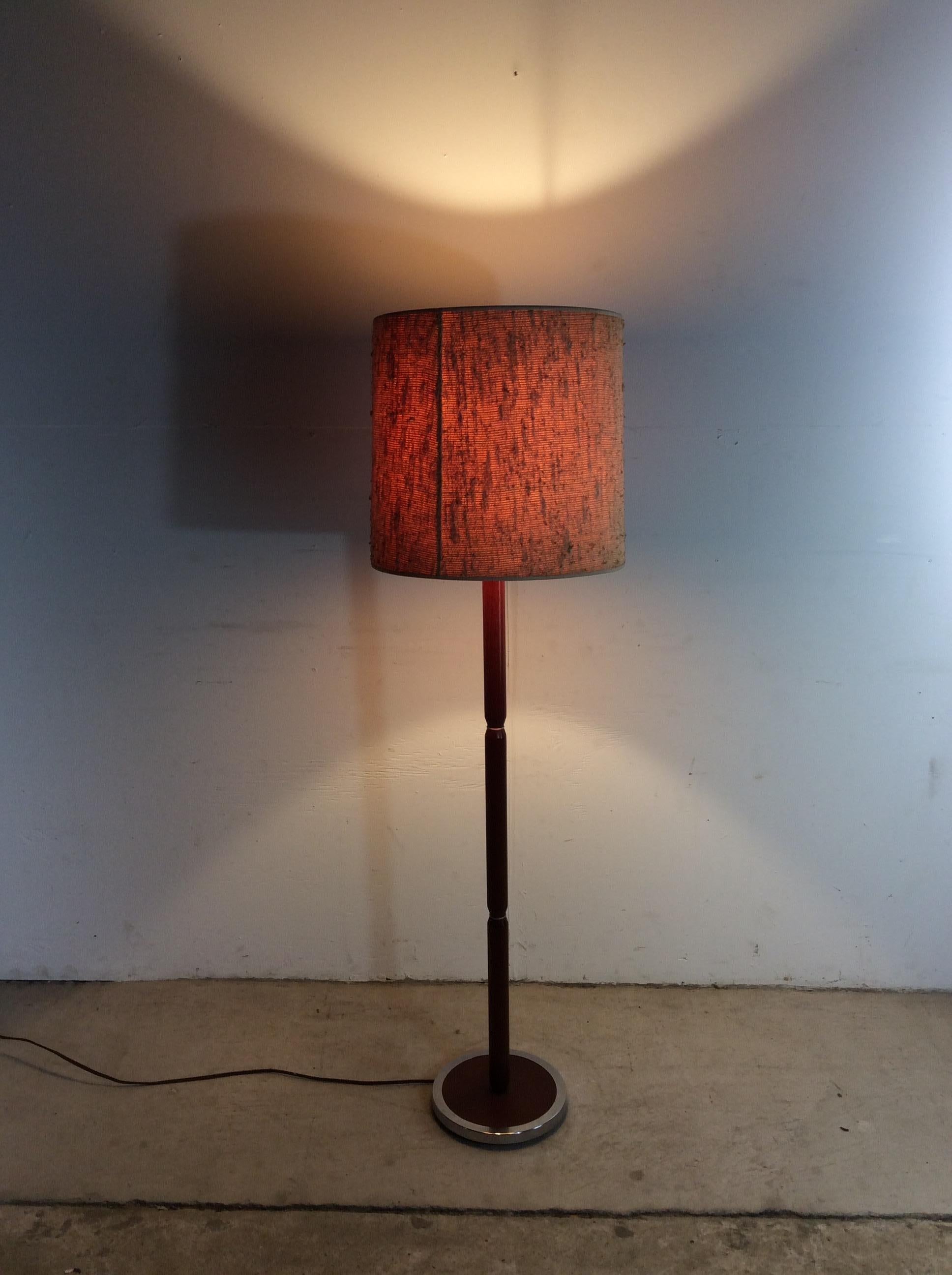 This Danish modern floor lamp features hardwood construction, original teak finish, chrome accented base, and vintage barrel shade.  Dimensions with shade: 15w 15d 56h

Dimensions: 10w 10d 56h

Condition: Original teak finish is in excellent