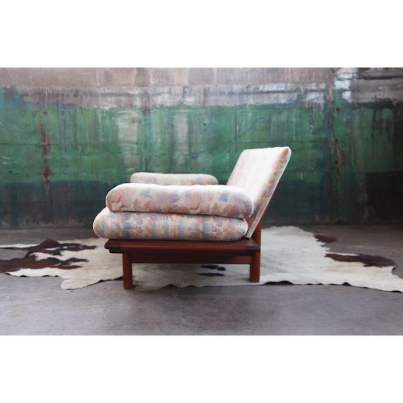 Solid Teak frame Original Danish Mid Century Modern very long Gondola Sofa. This design is pleasing to the eye, and versatile in a Mid Century, Post Modern, as well as Modern decor.

The upholstery is original and in a very cool pastel floral high