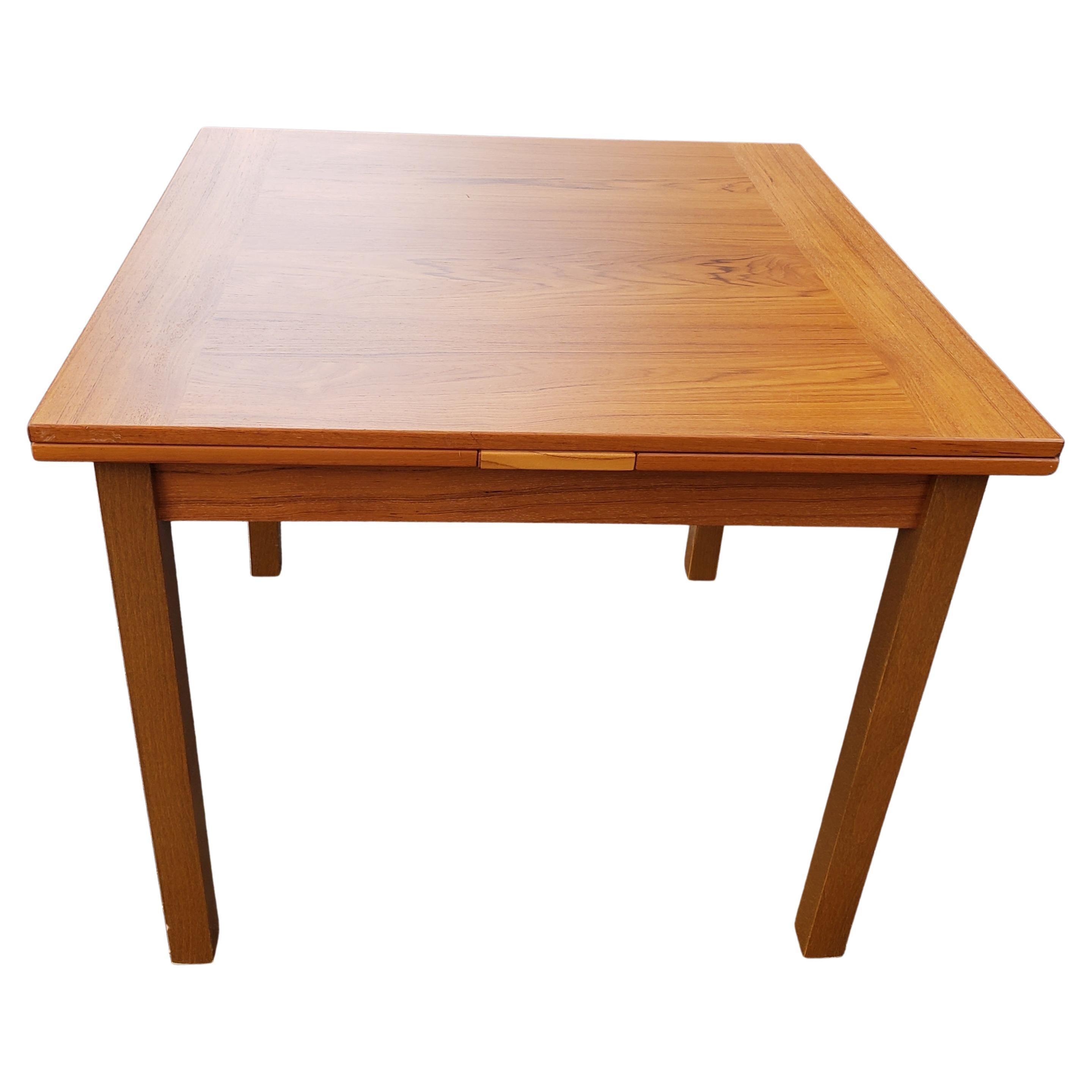 Scandinavian Modern Danish Modern Teak Hidden Leaves Expandable Dining Table 