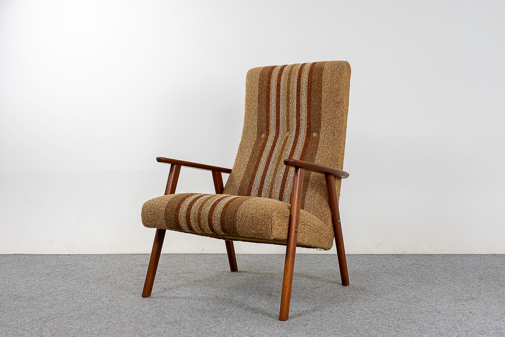 Teak Danish midcentury lounge chair, circa 1960s. High back provides ample support for your neck, a very comfortable sit! Original striped upholstery in nice condition. Settle in with a good book in this gorgeous lounger.