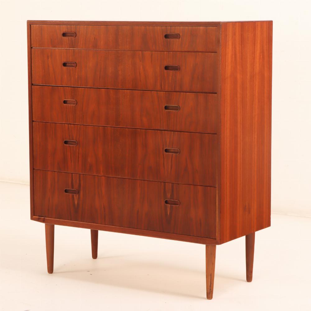 This style of highboy dresser by Falster is constructed of beautiful warm teak with stunning graining and has five dovetailed drawers featuring recessed pulls, all supported by turned legs. Stamped with FALSTER label in a drawer. This will make a
