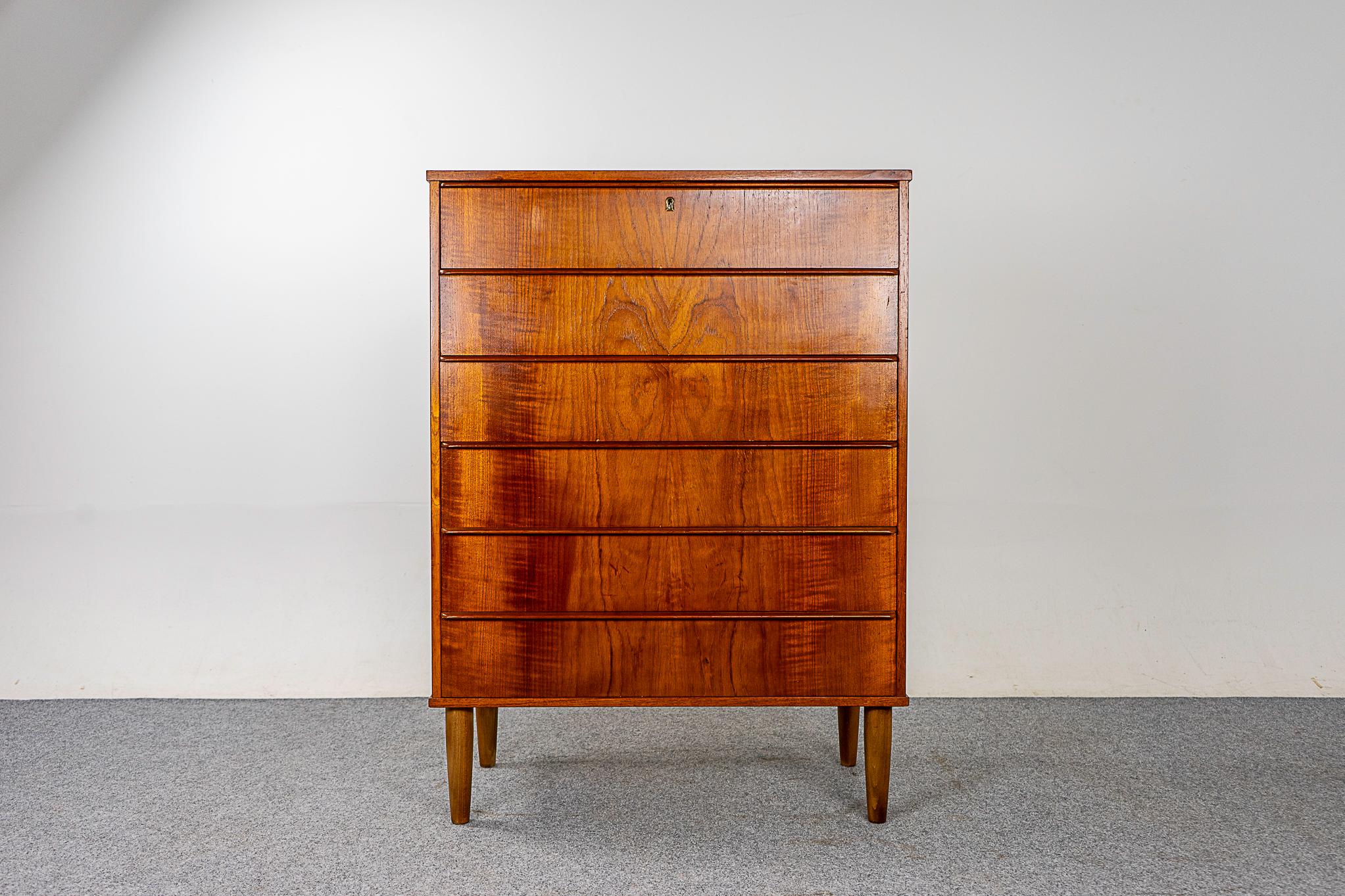 Teak Danish modern highboy dresser, circa 1960's. Six drawer dresser with solid wood edging and stunning book-matched veneer. Dovetail construction and integrated horizontal drawer pulls, opening and closing the drawers is a breeze!

Please inquire