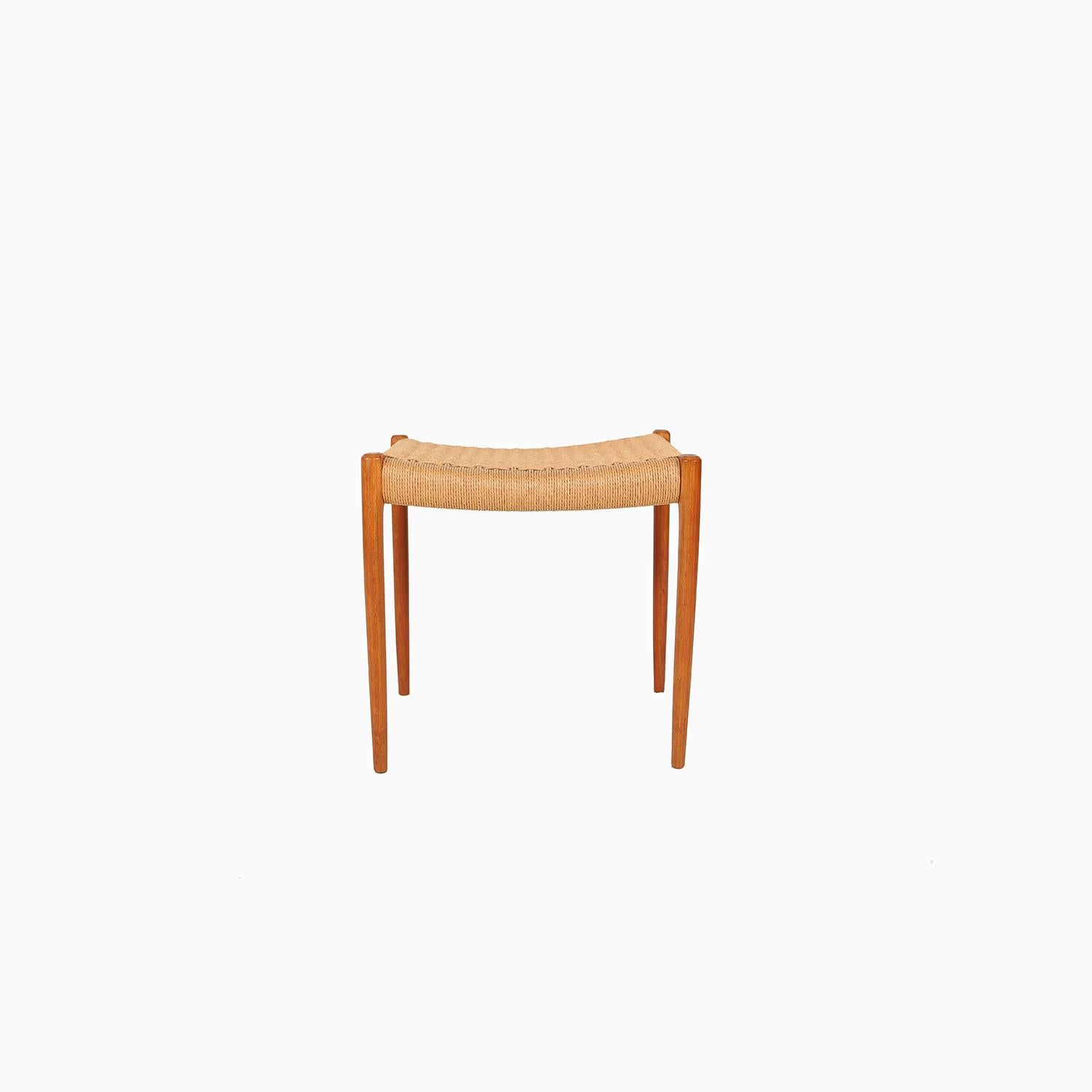 A classic Danish modern stool produced by J.L. Møller. Teak legs with paper cord seat. Original paper cord is in good condition with a light patina.

Professional, skilled furniture restoration is an integral part of what we do every day. Our goal