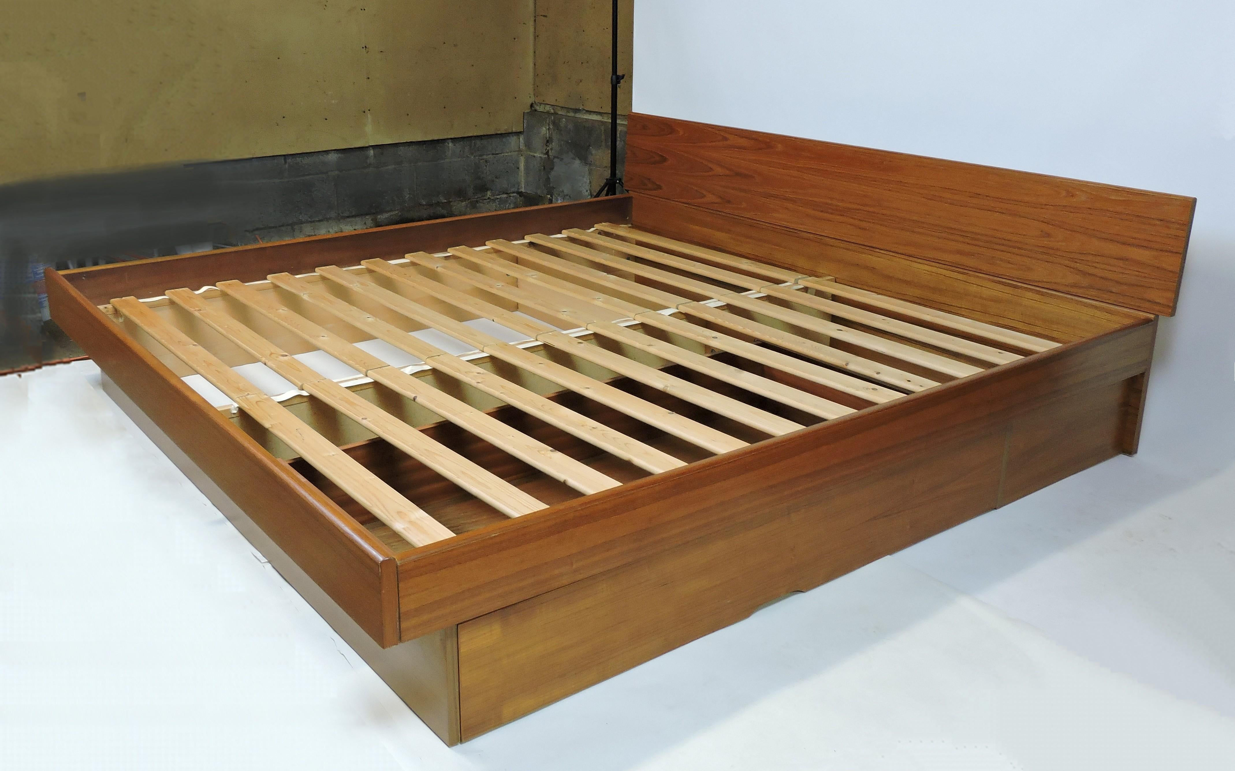 Danish Modern teak king size platform bed frame which also has a large pull out drawer underneath for storage. The inside dimensions for the mattress are 78 inches wide by 80.5 inches long. This can be used with or without the headboard (picture #