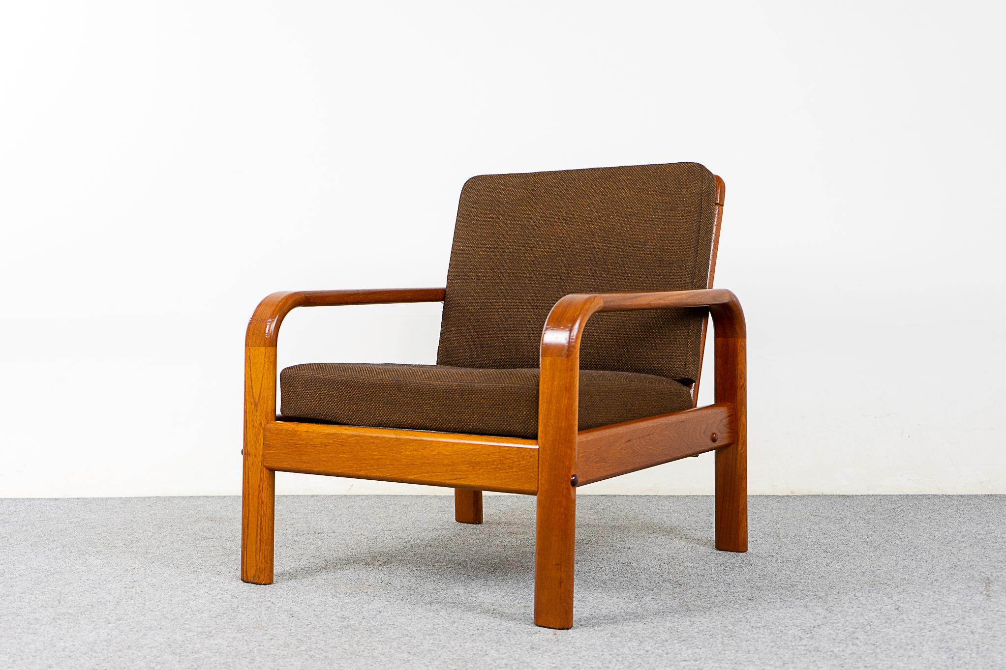 Teak mid-century lounge chair, circa 1960's. Sculpted solid frame with beautiful smooth joinery. Robust design with original cushions, in nice condition!