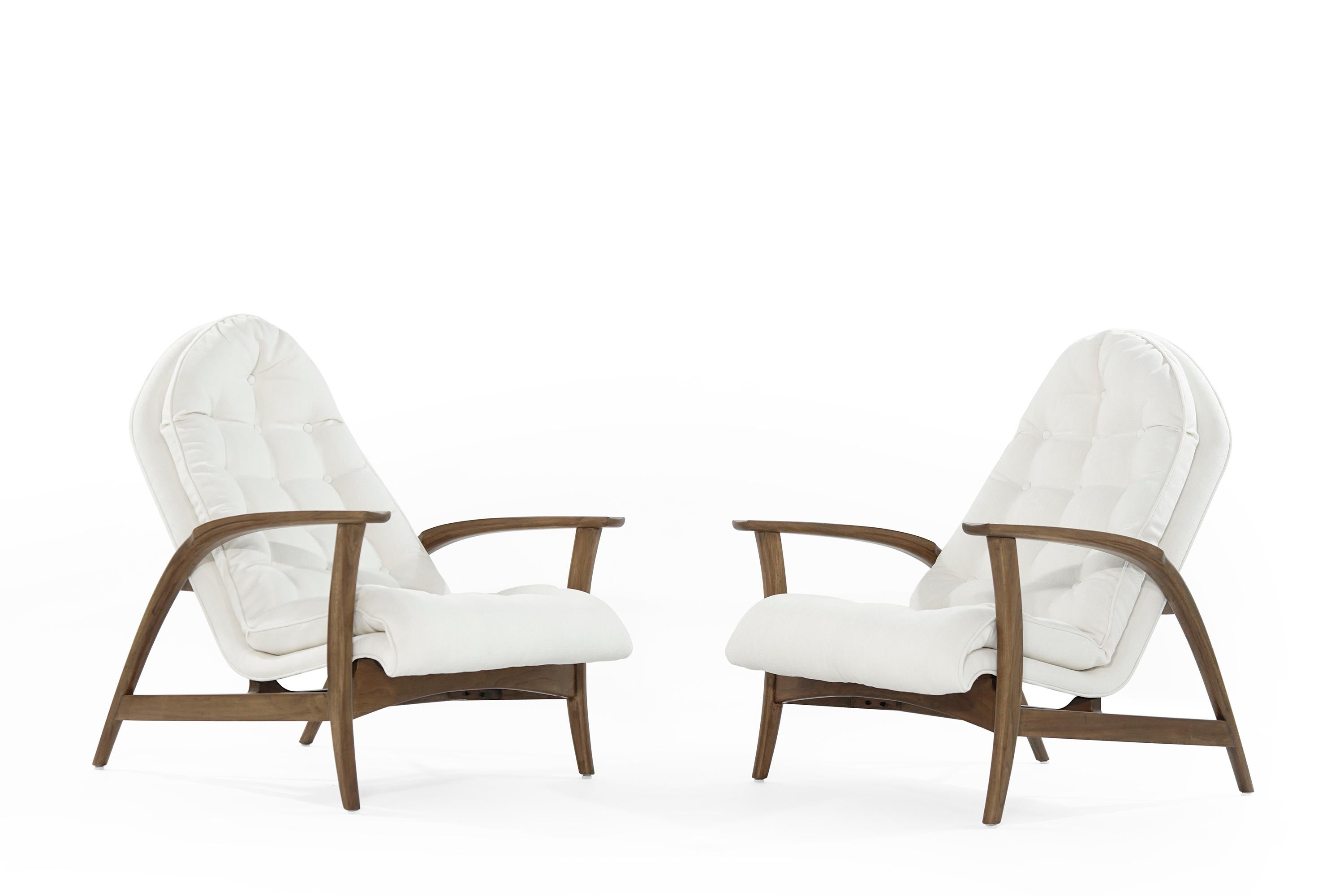 Exceptional set of lounge chairs in the style of Finn Juhl original from Denmark, circa 1960s. Featuring fully restored sculptural teak framing. Tufted seats and backrest newly upholstered in linen by Kravet. Priced as pair.