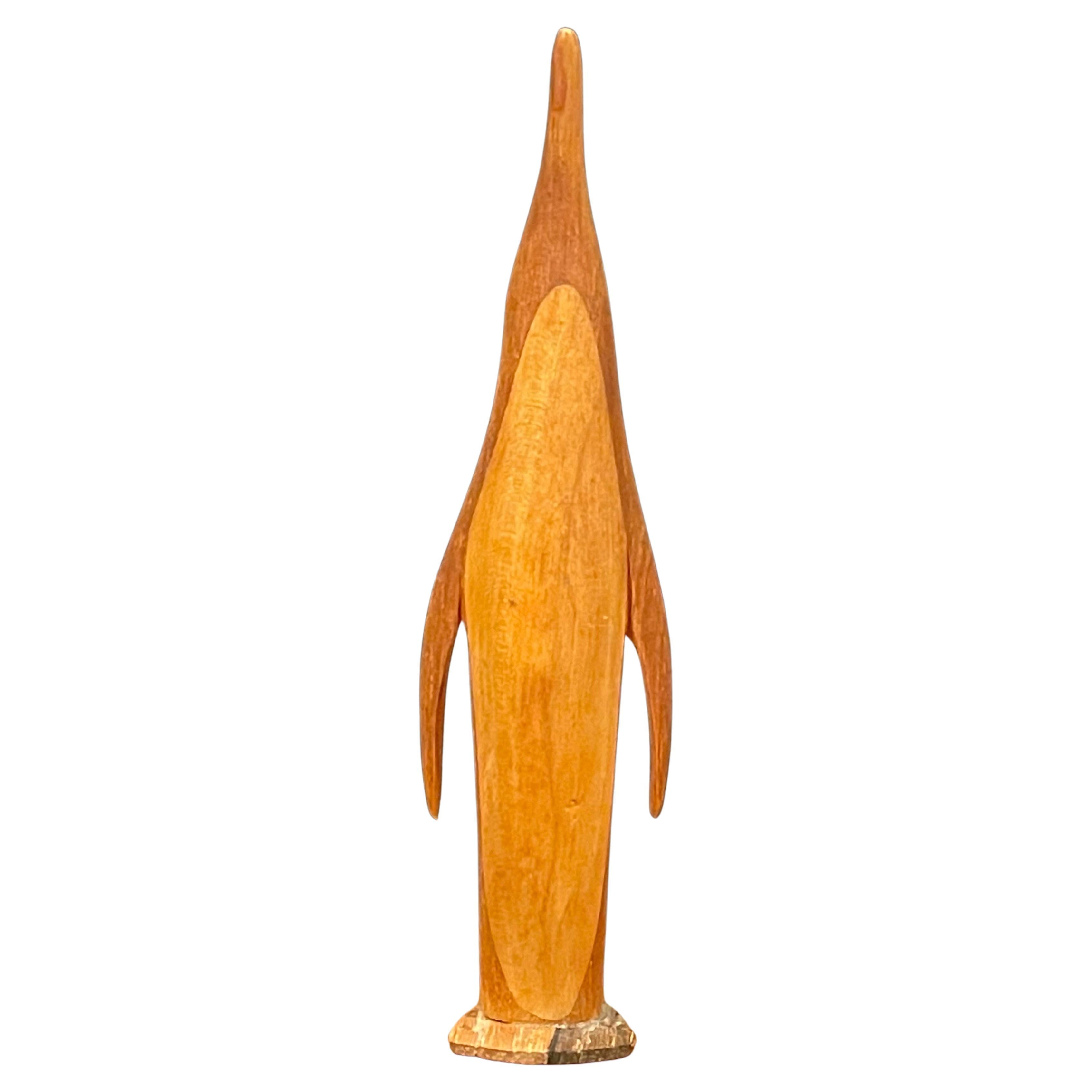 MCM teak penguin sculpture, circa 1960s. The piece is finely crafted and made of teak with a second lighter unidentified wood. The penguin is in good vintage condition and measures 1.5