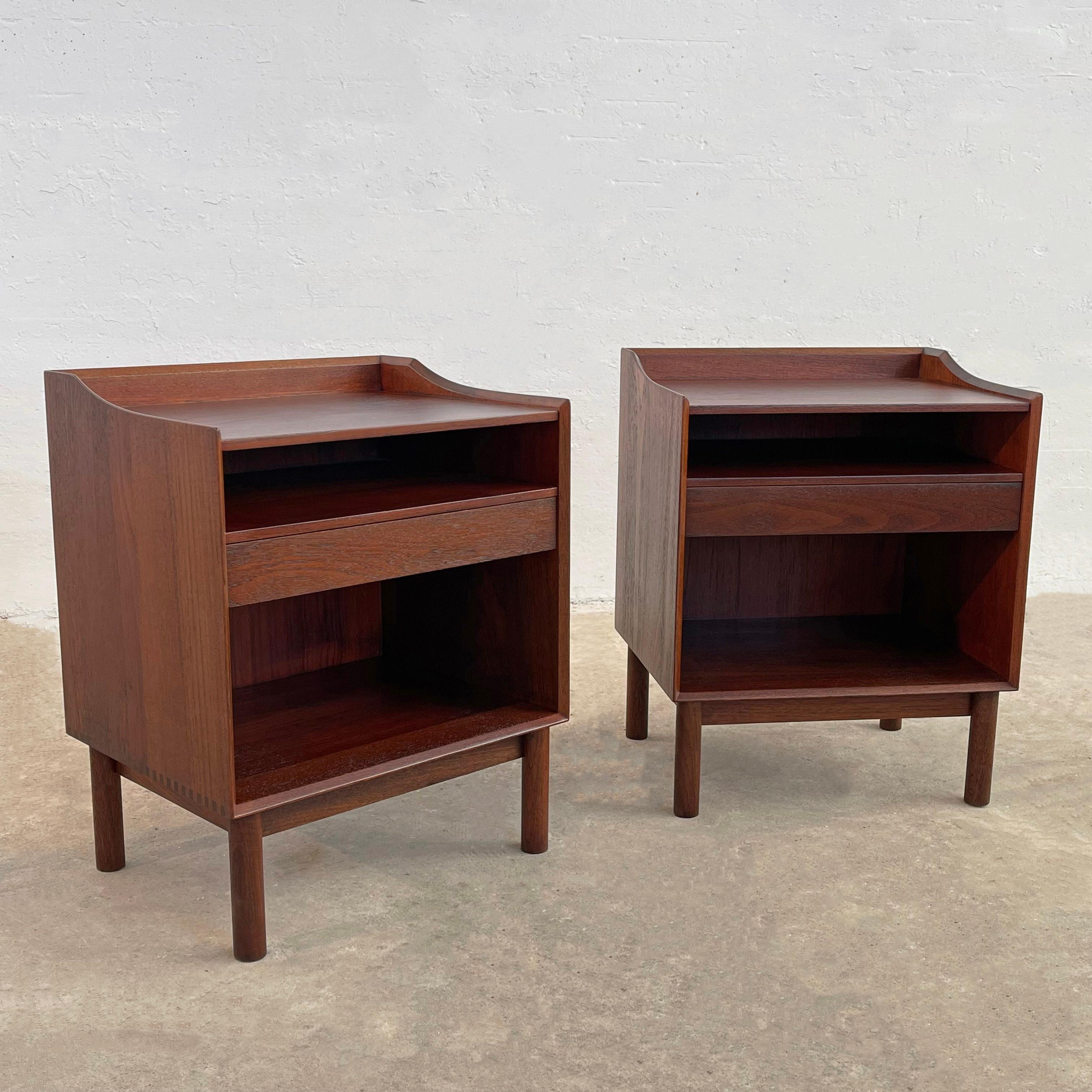 Pair of streamlined, Danish modern, teak nighstands or end tables by Peter Hvidt and Orla Molgaard-Nielsen for Soborg Mobelfabrik retailed through John Stuart in the U.S., feature middle drawers with open storage above and below. Sleek design and